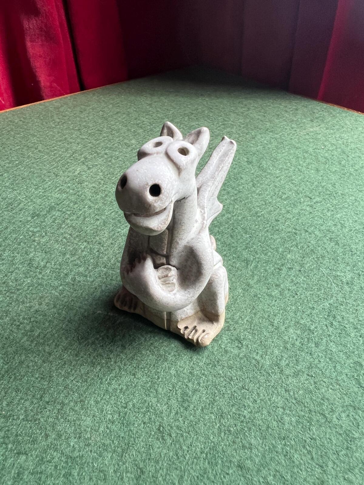 Hand built pottery dragon figurine. Grey clay ready to be painted dragon.