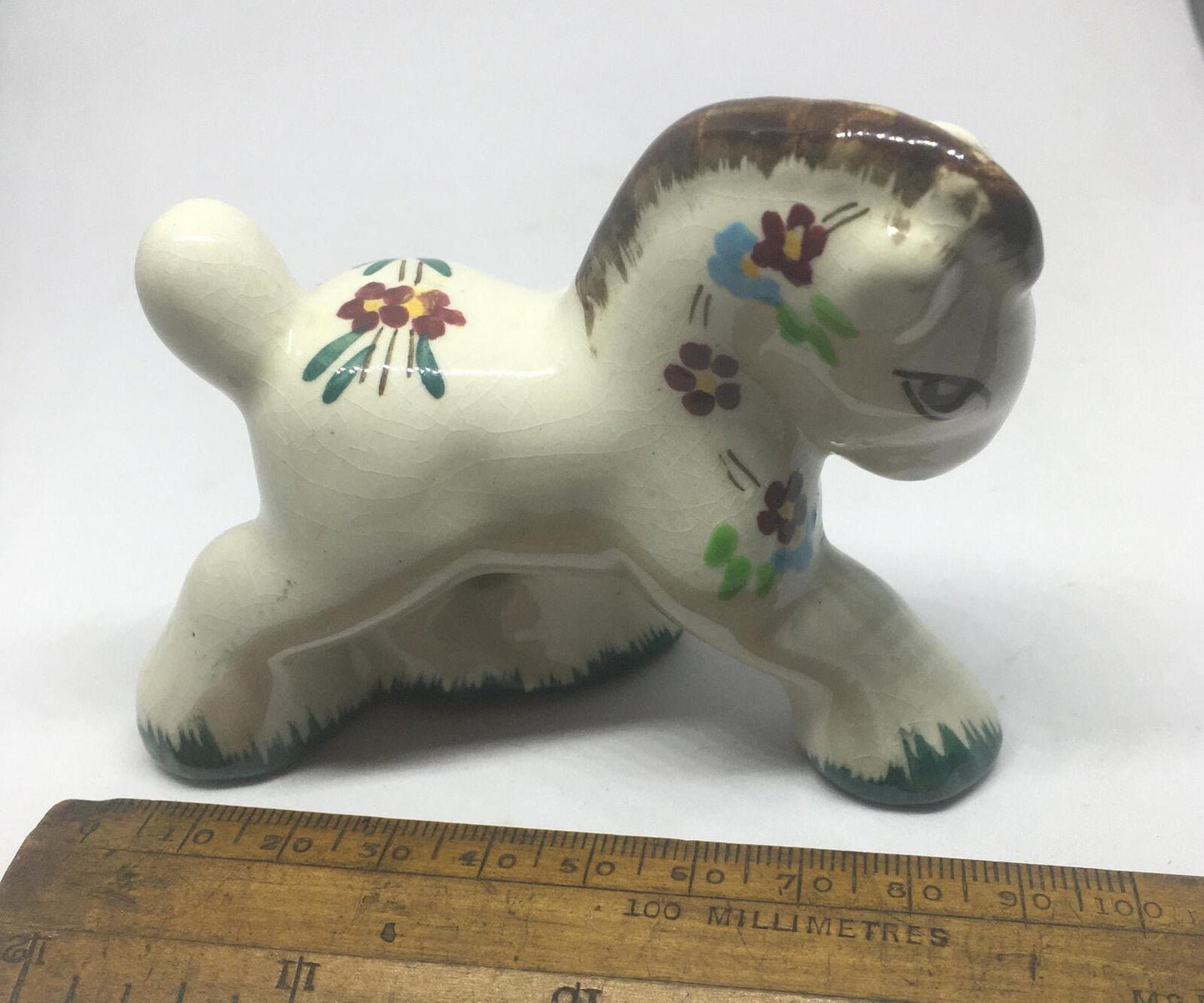 Folk art ceramic pony. Quirky hand-painted prancing ceramic pony.
