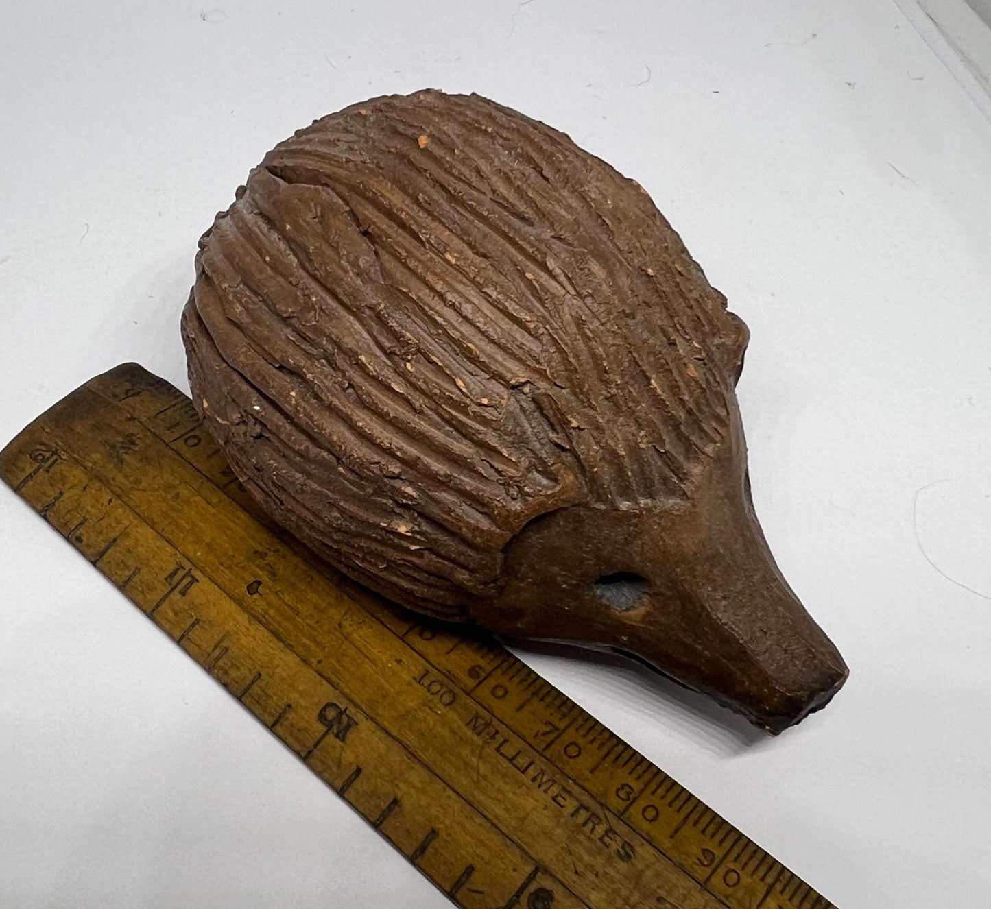 Terracotta hedgehog ornament.