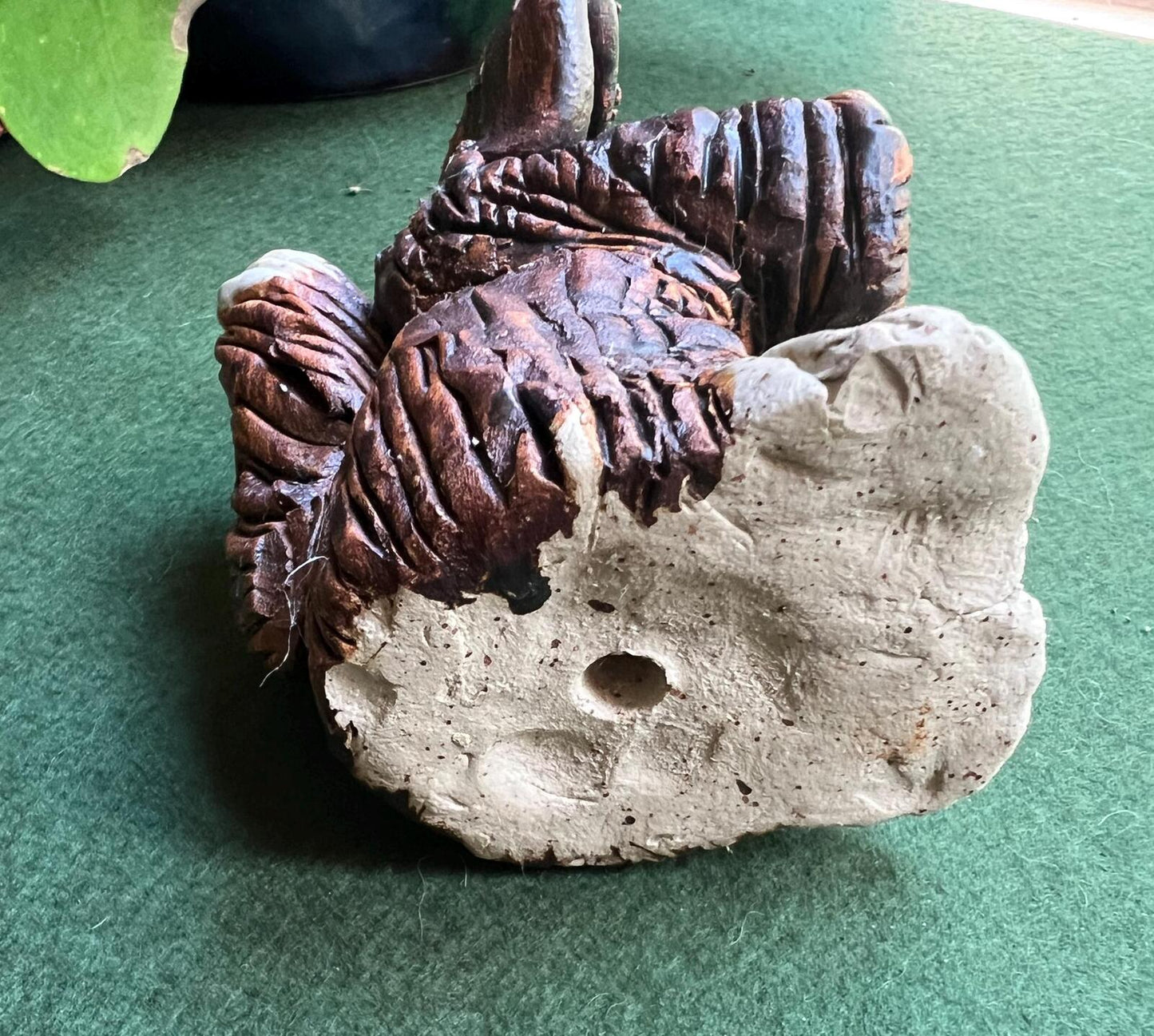 Hand built studio pottery brown glazed dog with its tongue out and quirky ears.