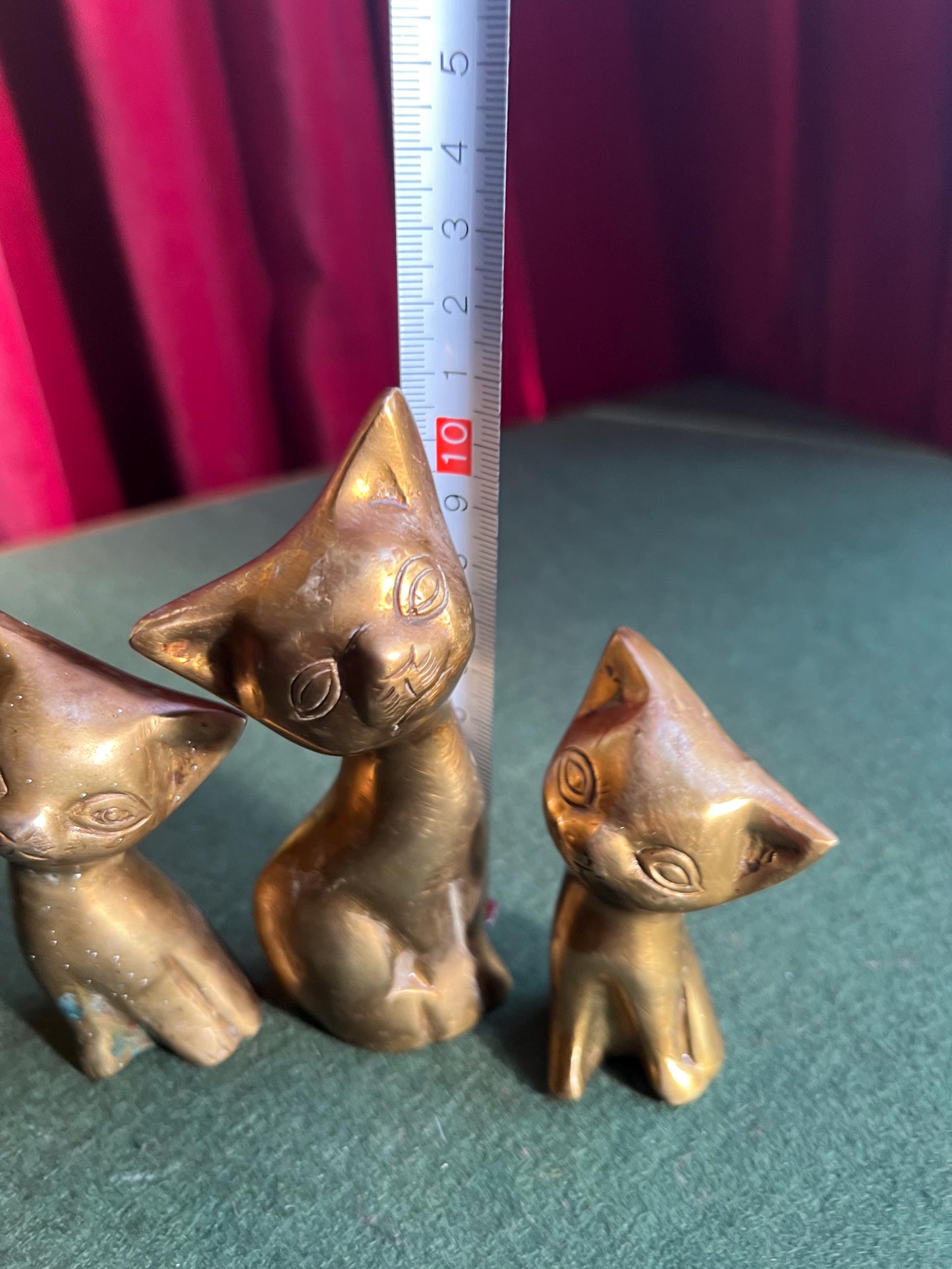 Vintage brass cat family. Quirky stylised mum cat and 2 kittens. Cat family paperweights.