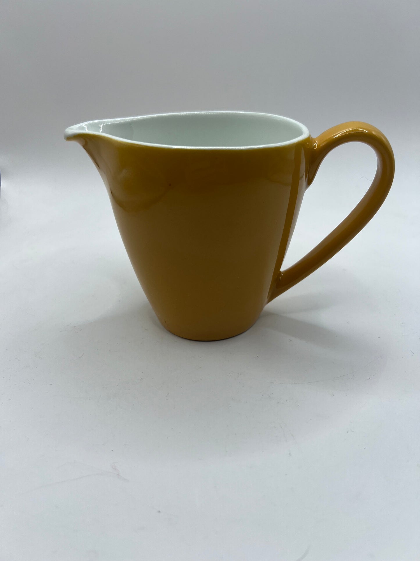 Vintage mustard yellow milk jug creamer. Stamped Johnson Bros England.