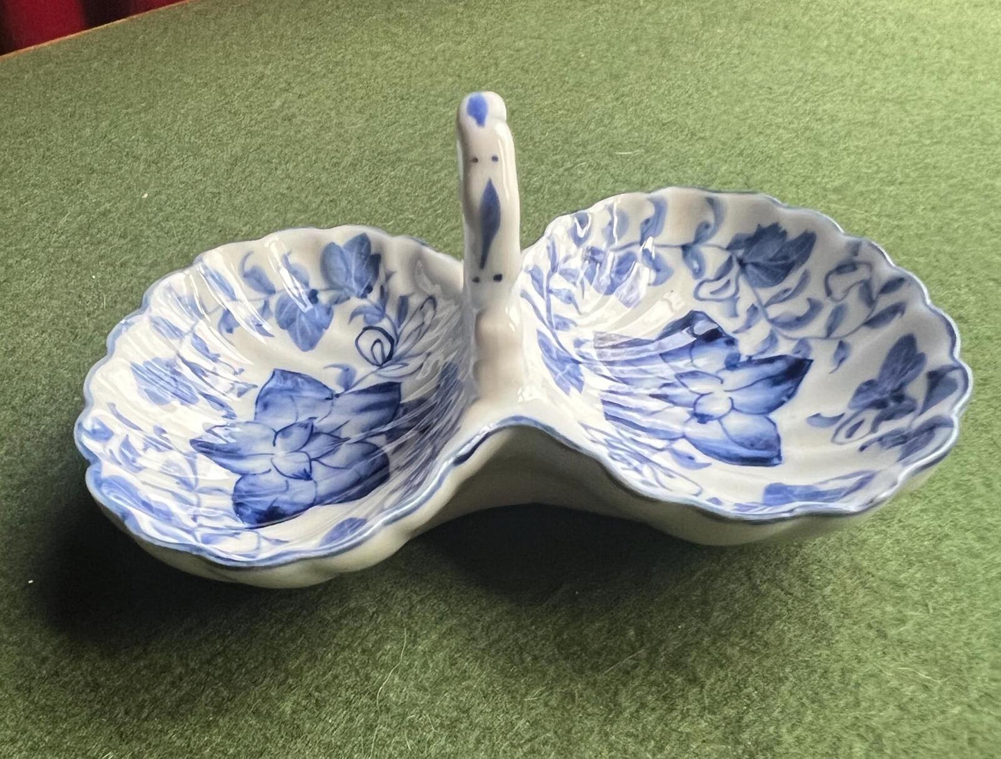 Vintage trinket dish. Ruffle edged handled blue white ceramic shell dish.