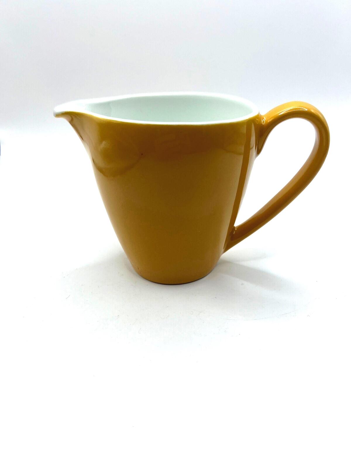 Vintage mustard yellow milk jug creamer. Stamped Johnson Bros England.