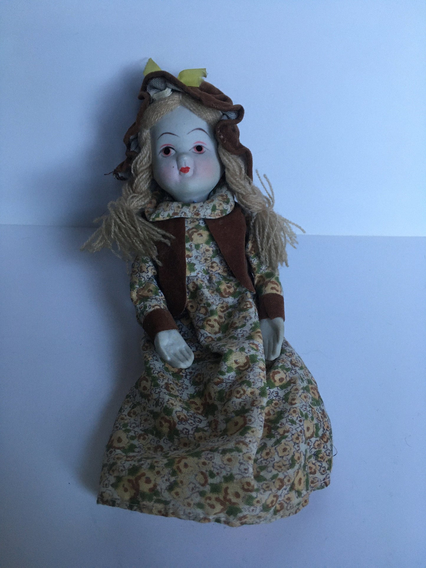 1970s ceramic doll in original clothes.