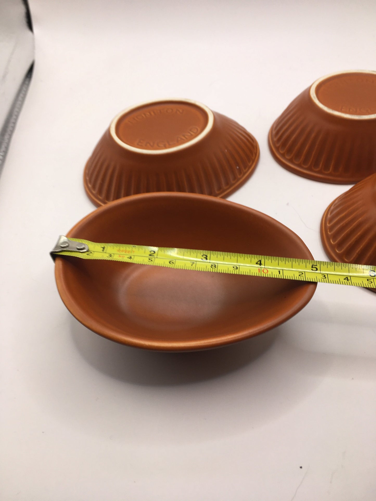 Honiton Pottery Avocado dishes. Set of 4 orange glazed stripe edged set.