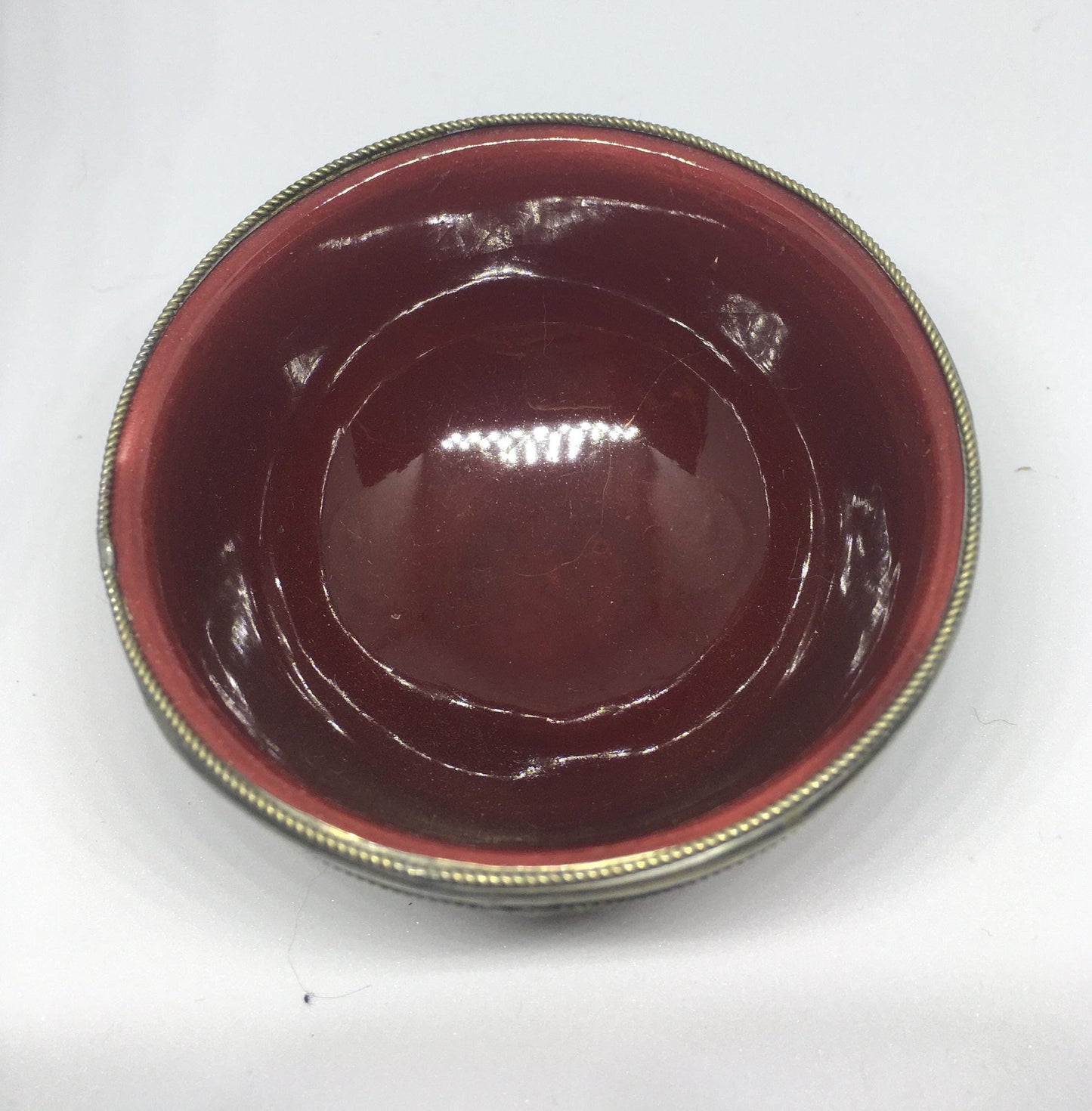 Vintage red glazed trinket pin dish with silver tone band.