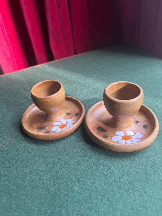 Pair of ceramic egg cups. Studio pottery brown glazed egg cups with integral saucers,
