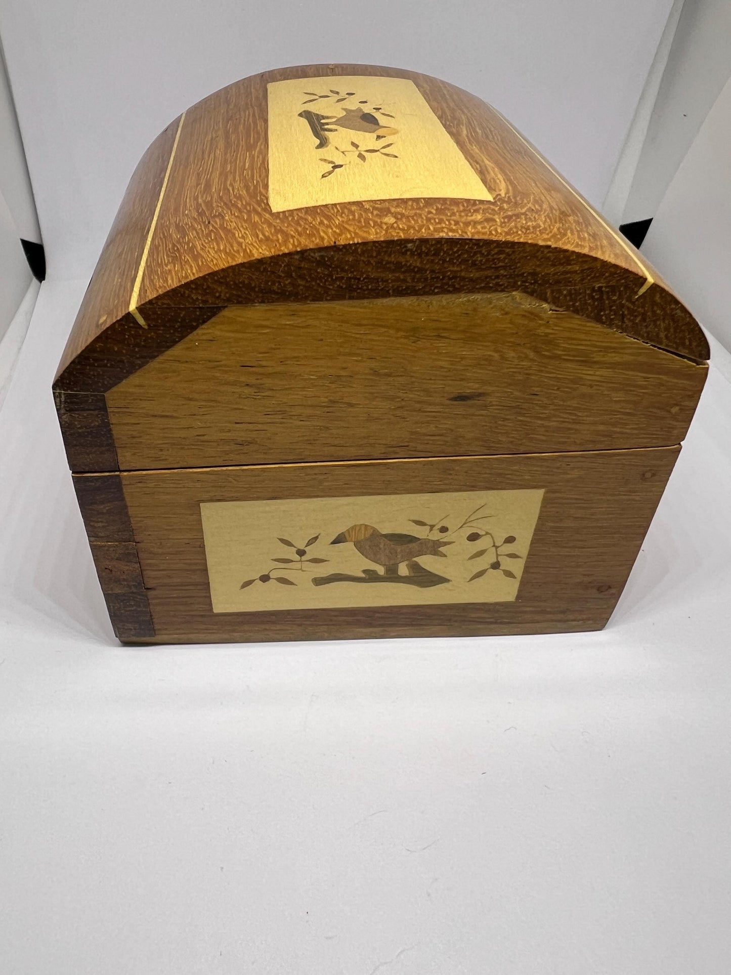 Wooden lidded secret lock treasure box. Inlaid marquetry bird themed domed jewellery box.