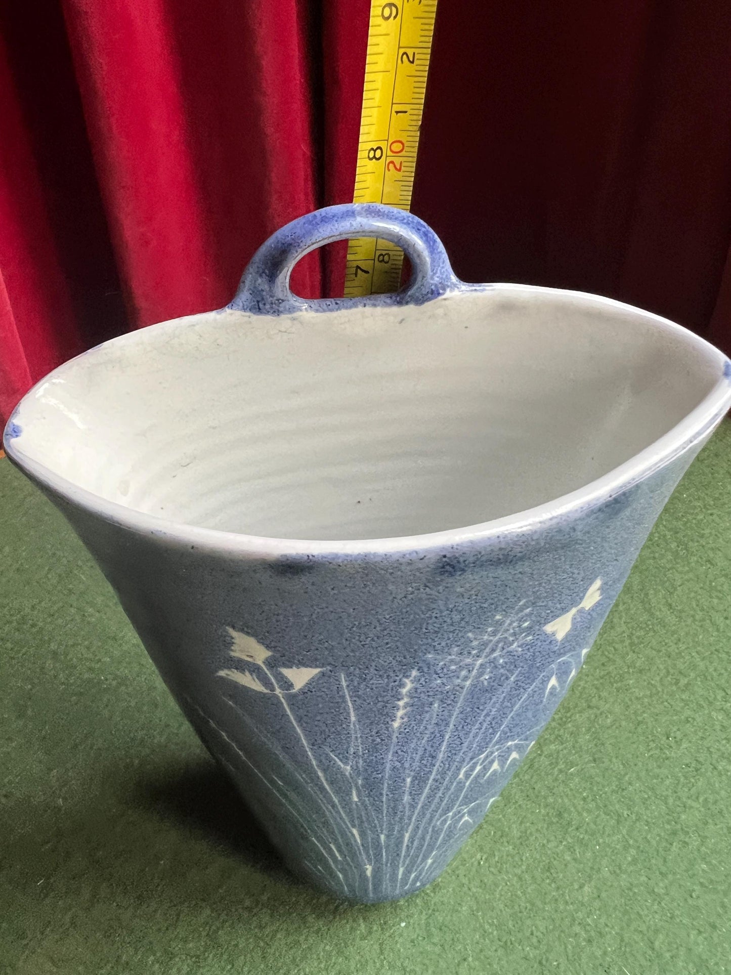 Studio pottery wall pocket. Blue glaze posy vase floral butterfly decor.