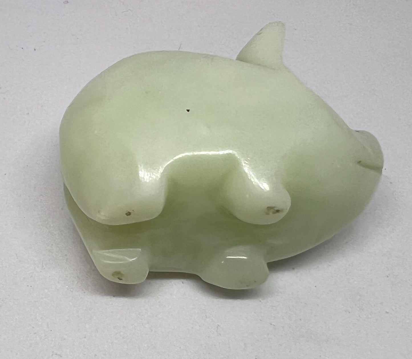 Vintage jade pig figurine. Cute carved white stone jade piglet ornament.