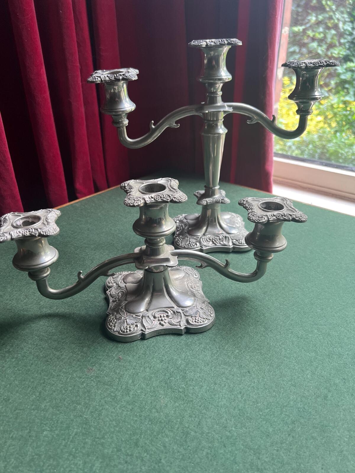 Pair of Vintage antique candlestick holders. Grape and vine pattern silver plated 3 arm candle holders. Mismatched heights.