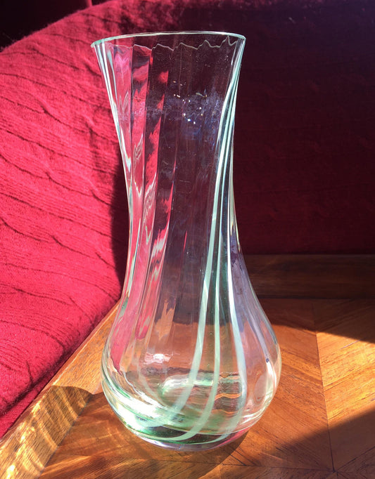 Beautiful vintage clear glass flower vase with green swirl detail. Heavy based.