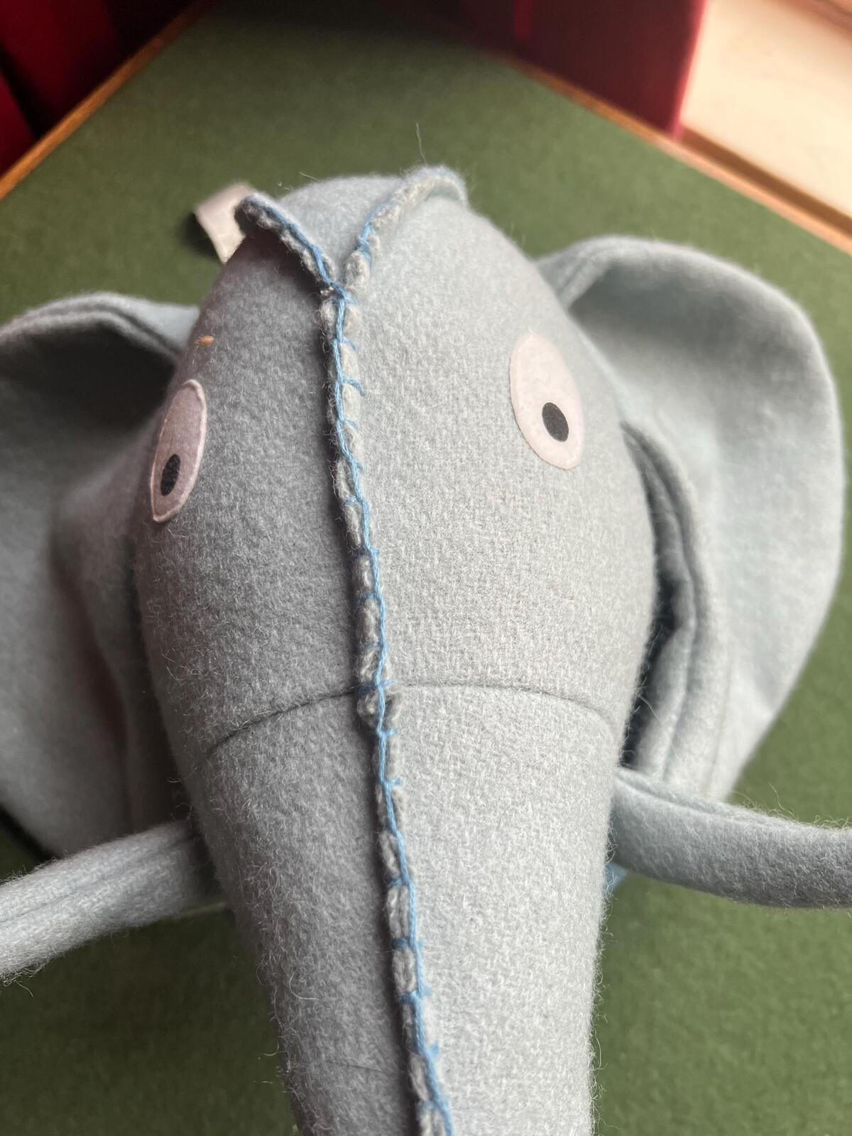 Felted elephant head wall decor for jungle nursery theme. Child's bedroom animal textile wall art.