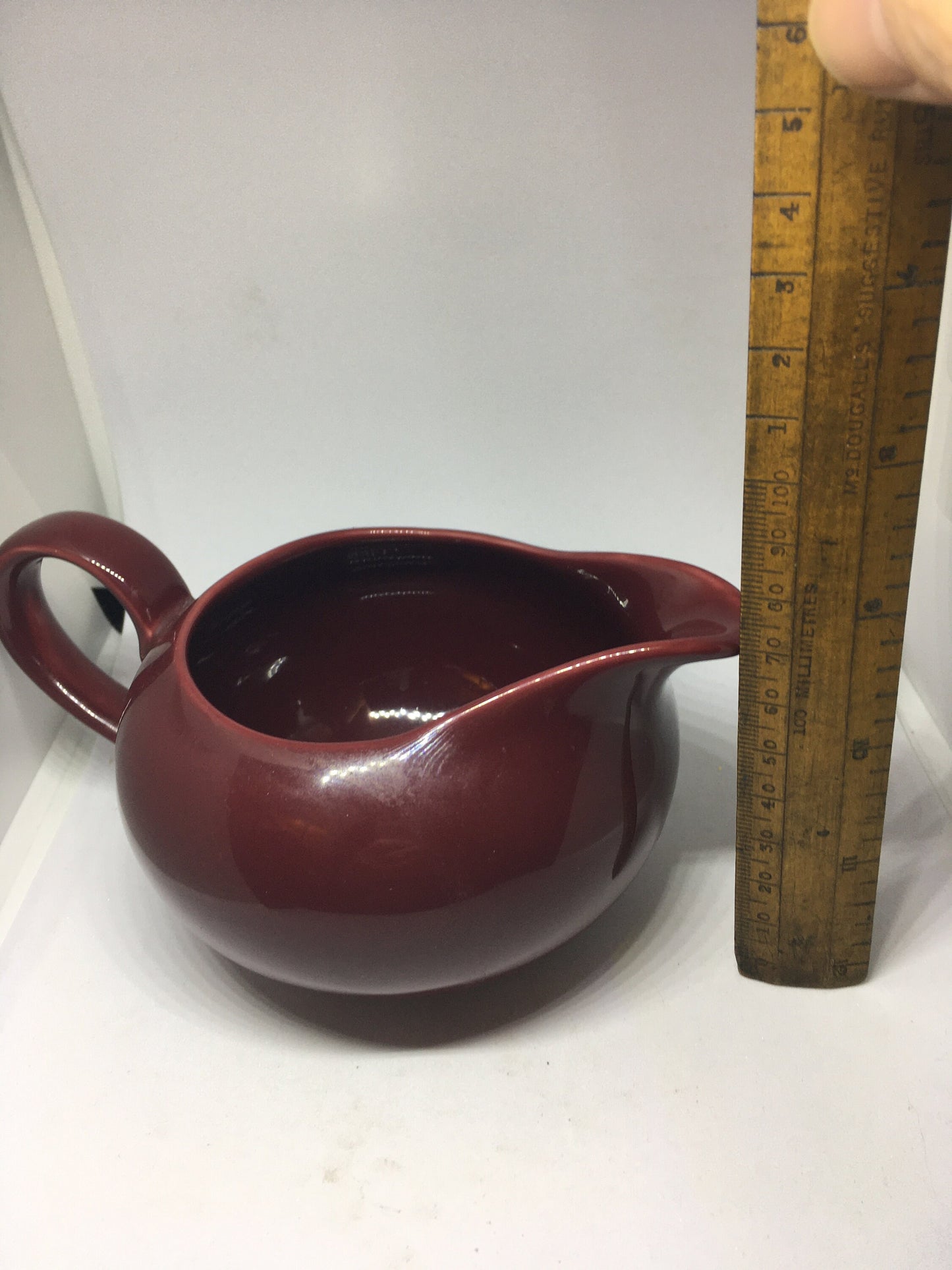 Rare vintage deep red Poole Pottery milk jug creamer sauce boat.