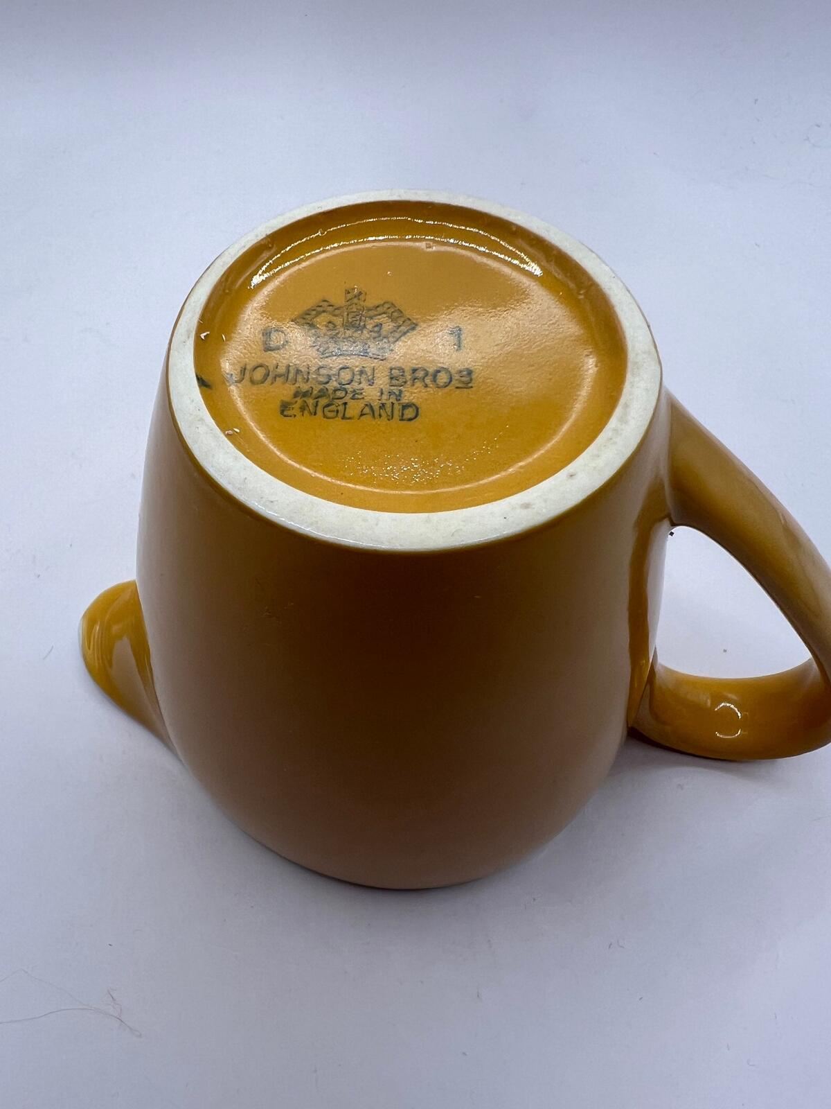 Vintage mustard yellow milk jug creamer. Stamped Johnson Bros England.