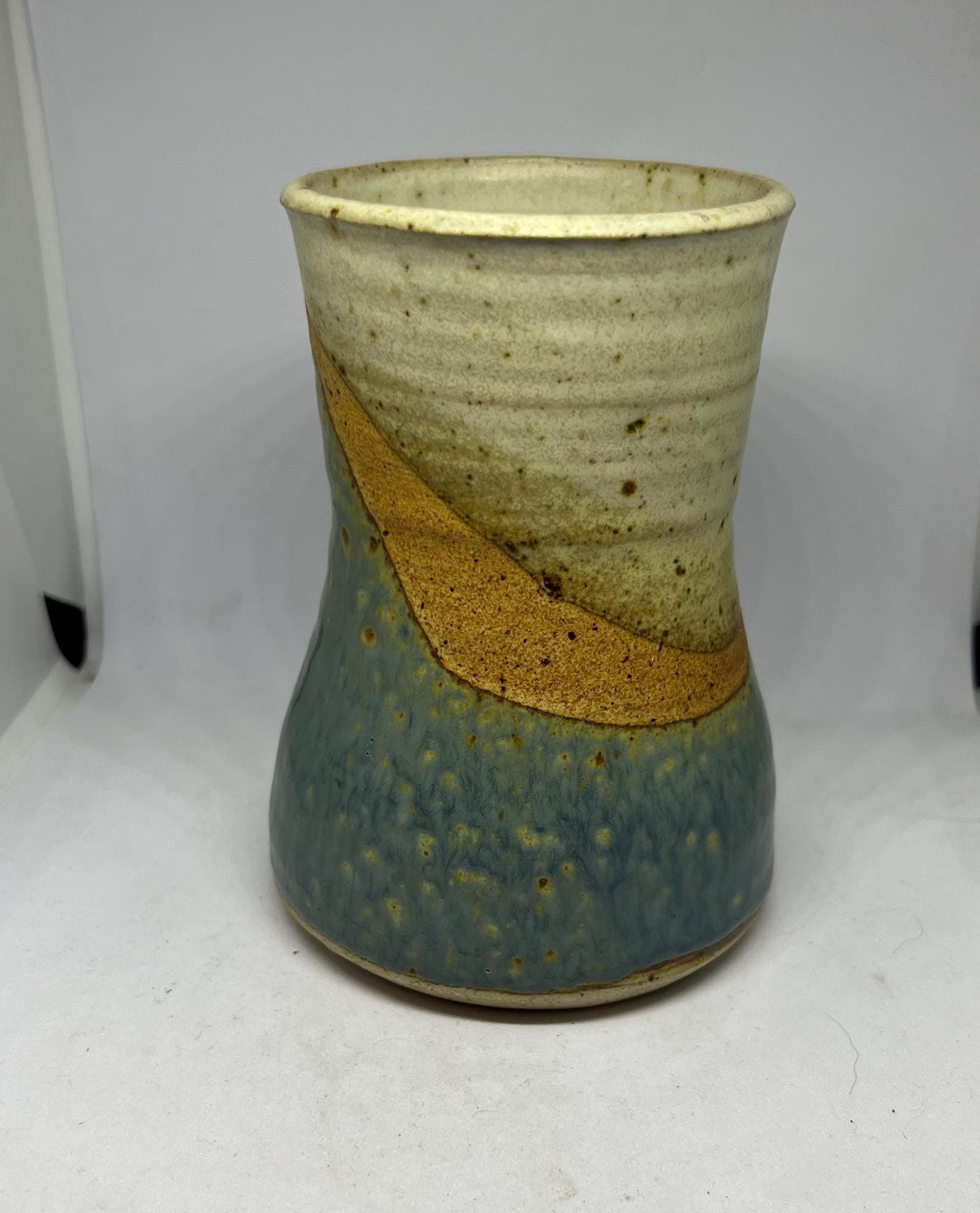 Studio pottery Blue brown speckled glaze flower vase.