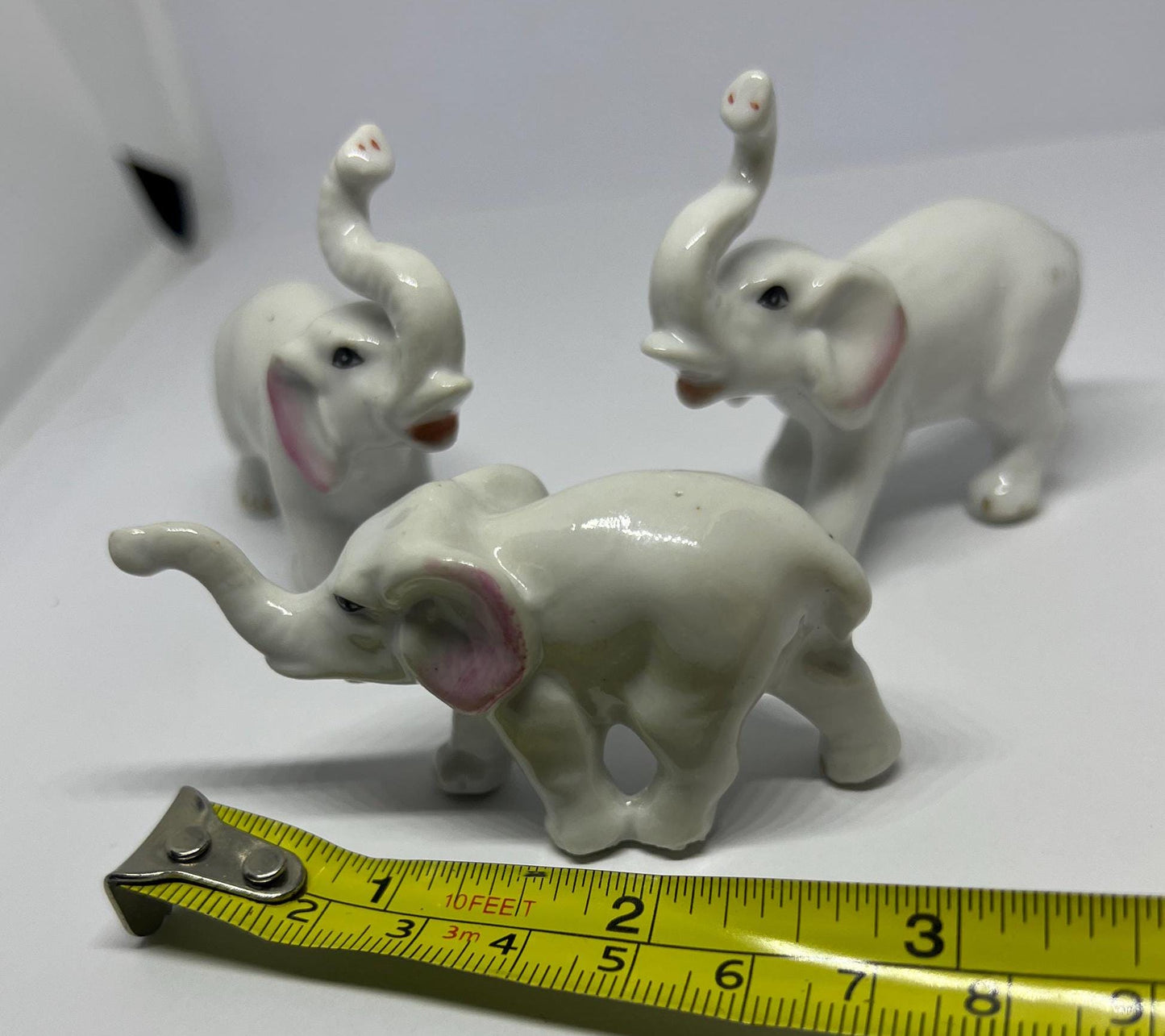 Ceramic elephant family. Lucky trunks raised mum dad and baby elephant collection.