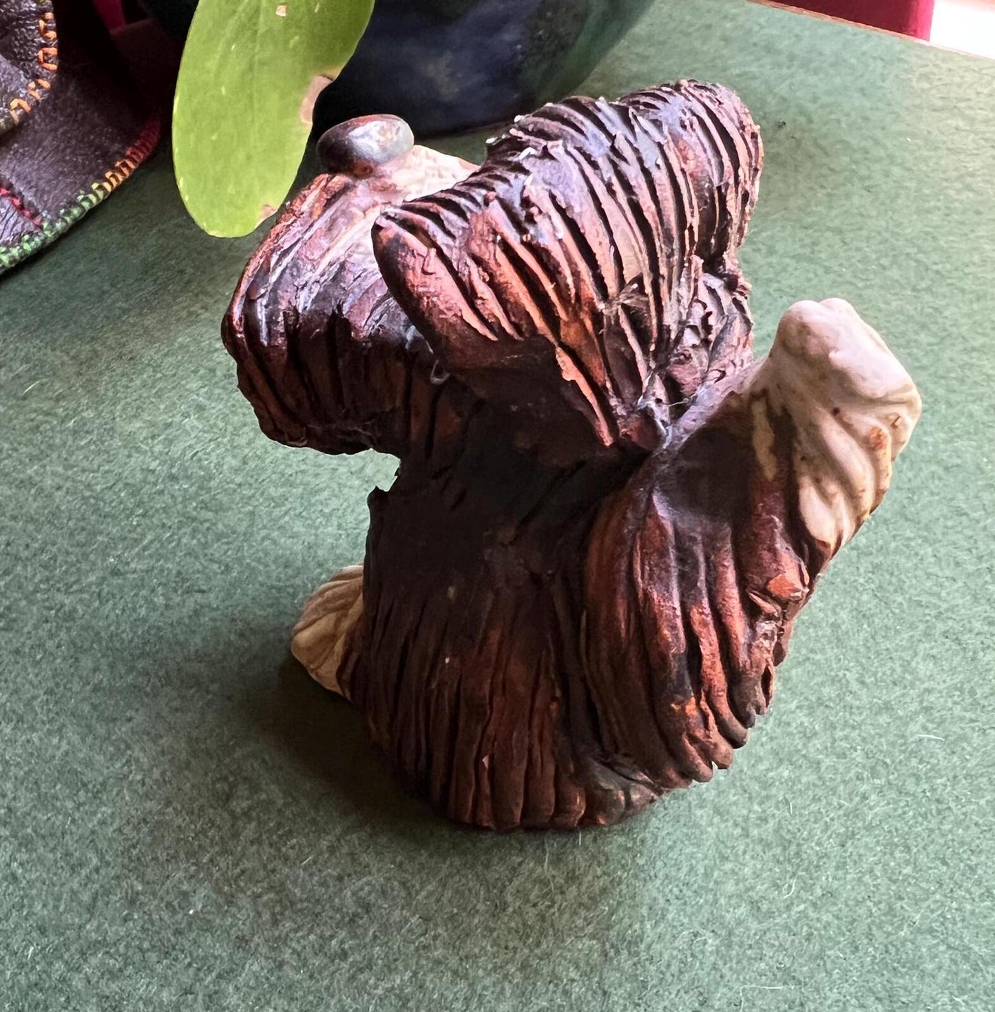 Hand built studio pottery brown glazed dog with its tongue out and quirky ears.