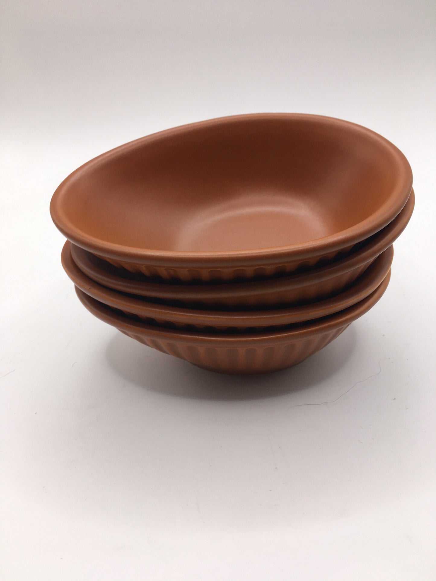Honiton Pottery Avocado dishes. Set of 4 orange glazed stripe edged set.