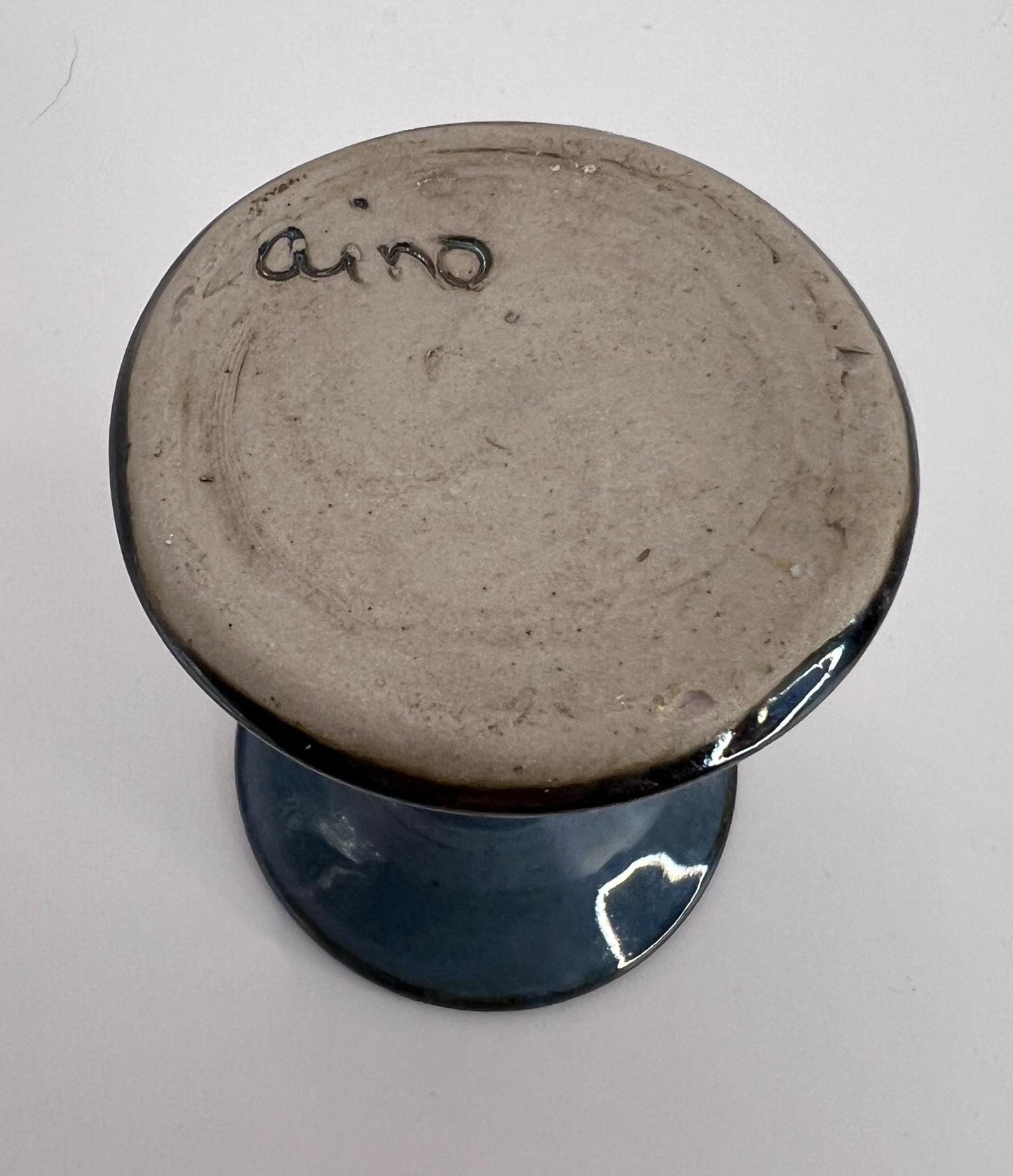 Blue black glaze trumpet vase. Marked 'aino'.