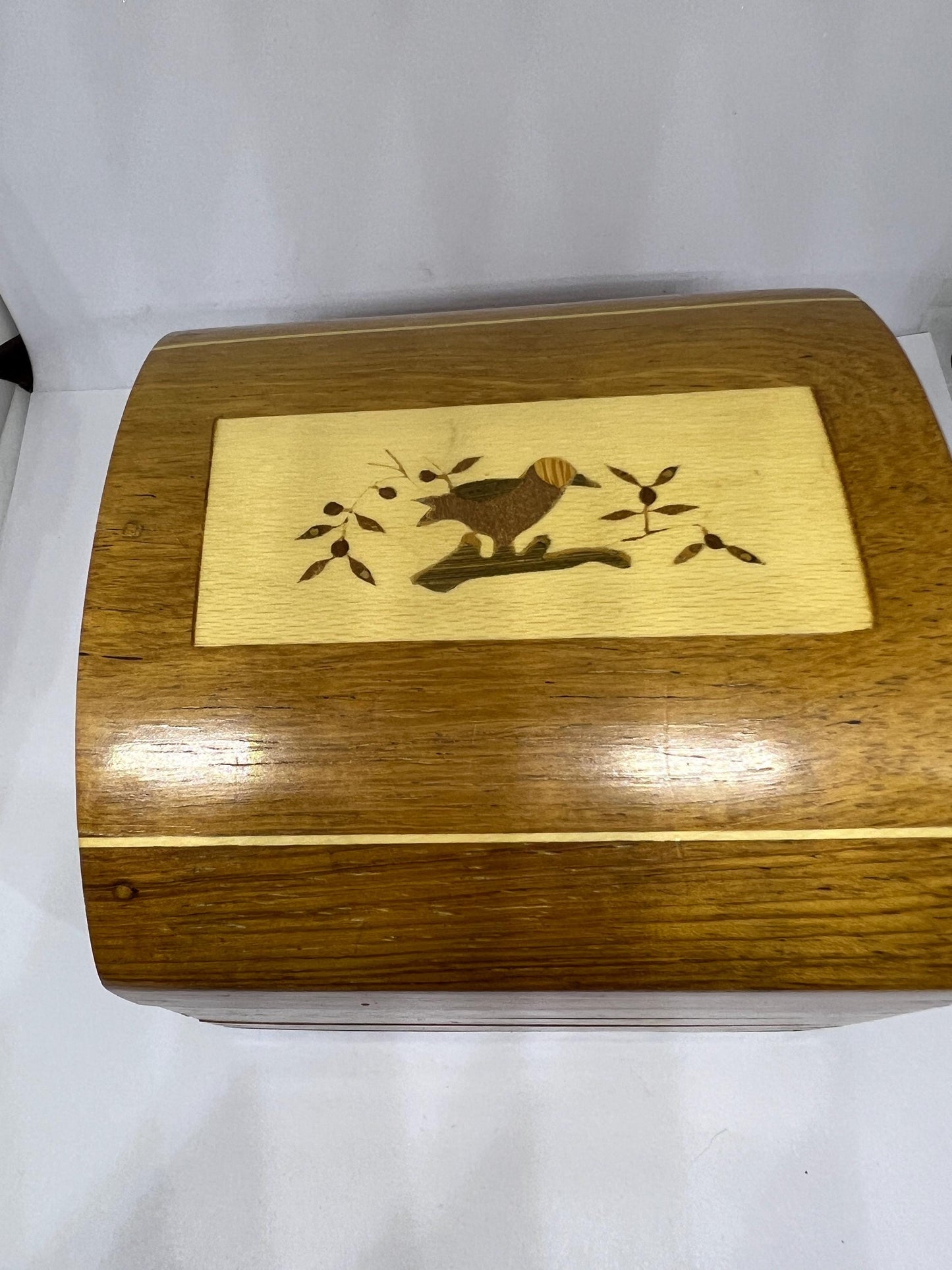 Wooden lidded secret lock treasure box. Inlaid marquetry bird themed domed jewellery box.