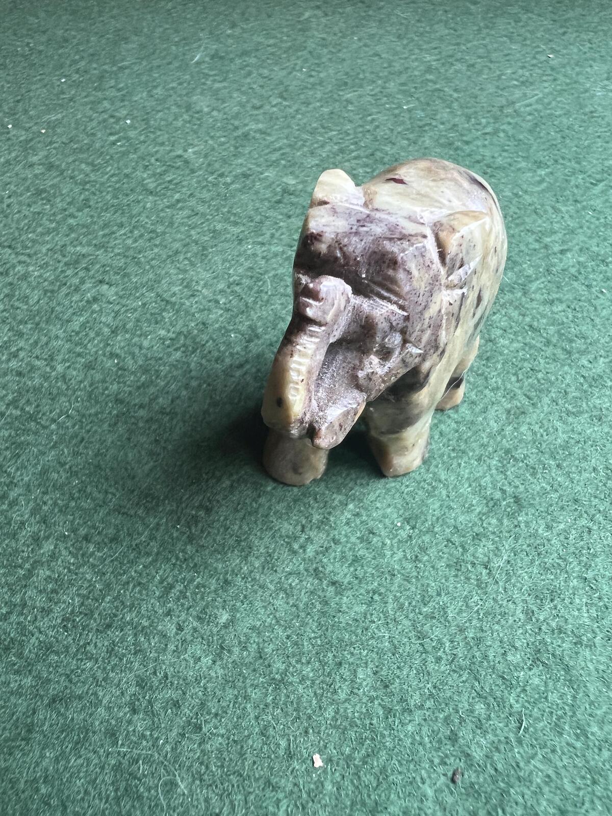 Stone elephant figure. Miniature marble hand carved lucky elephant.