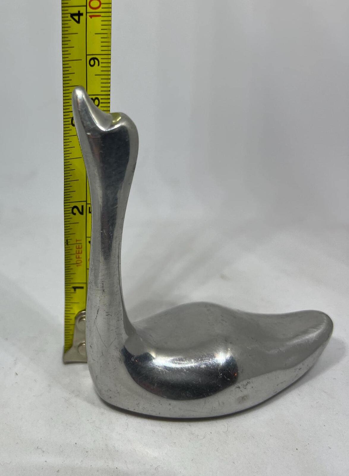Silver tone swan figurine ring holder.  Signed to base Indistinct Canada 981.