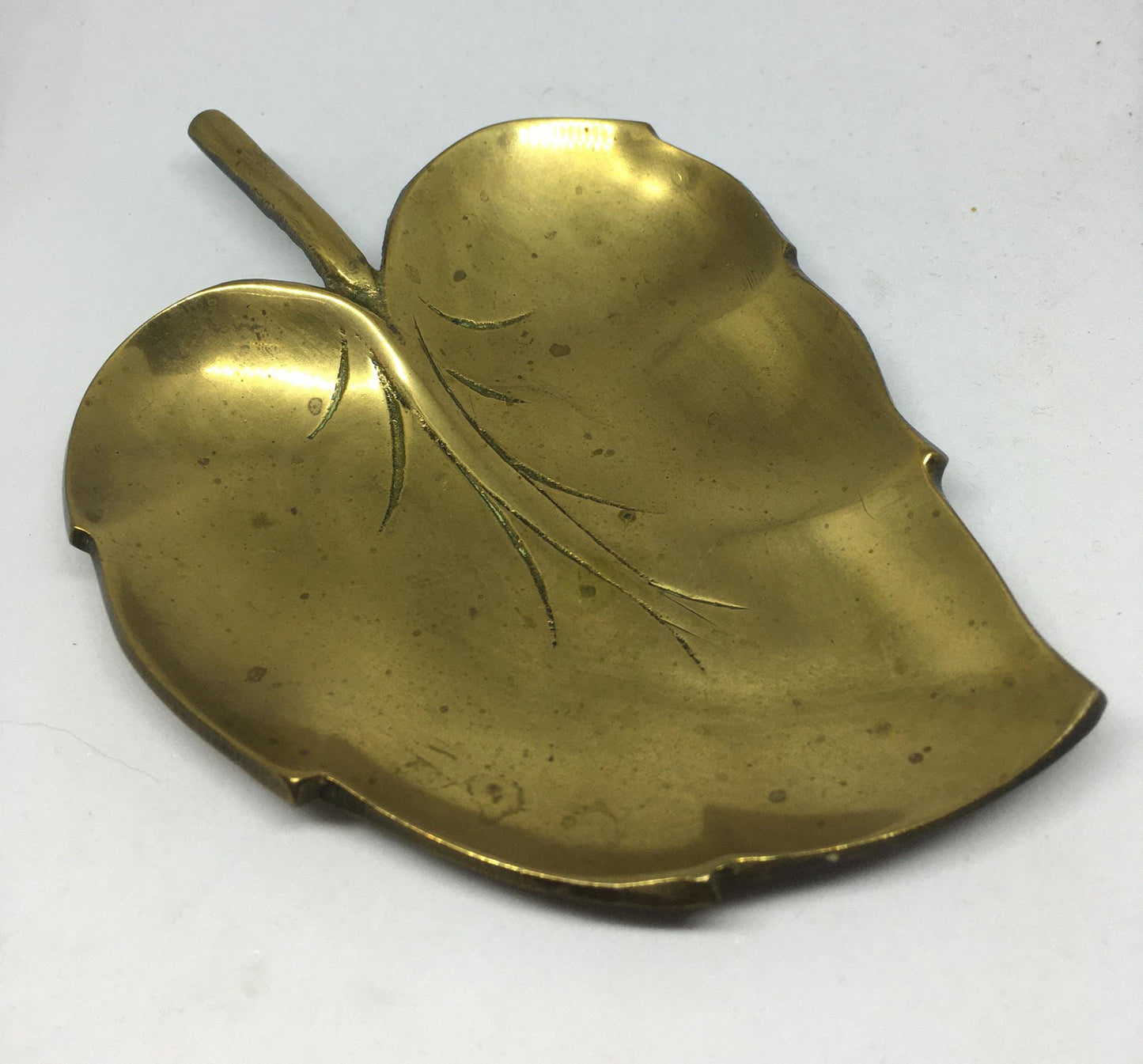 Decorative brass leaf trinket key dish.