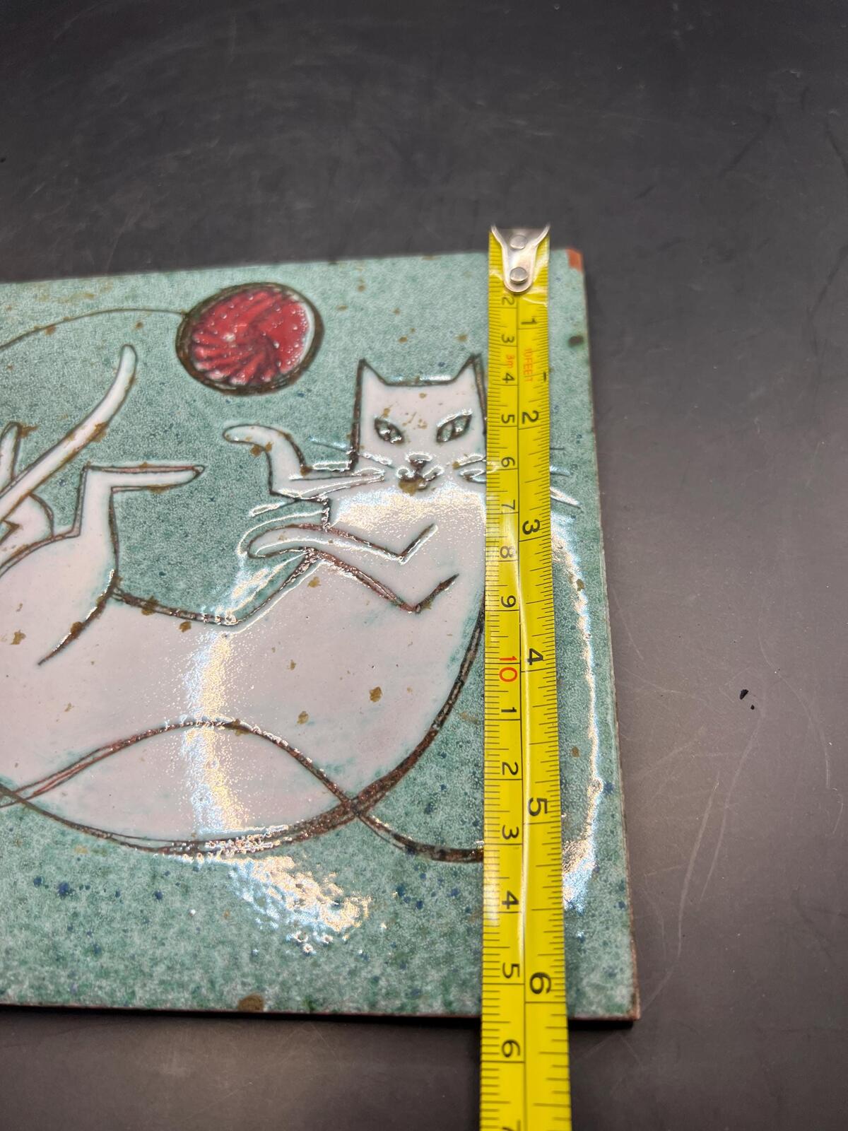 Hand made Cat tile signed Christina Shepherd original. White cat playing with a red balloon.