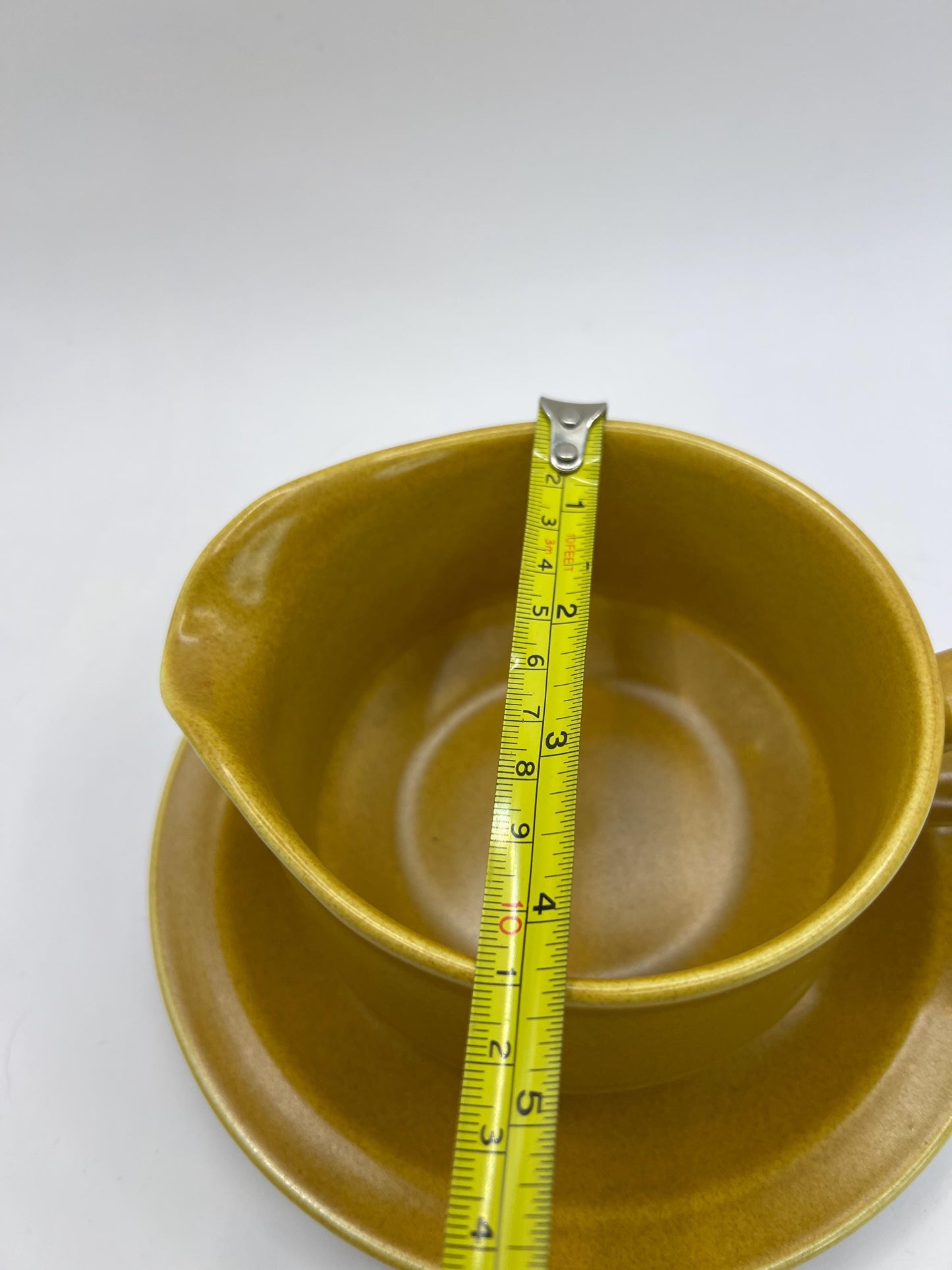 Mustard yellow ceramic gravy sauce boat and saucer. Stamped Glo-white Ironstone Alfred Meakin England.