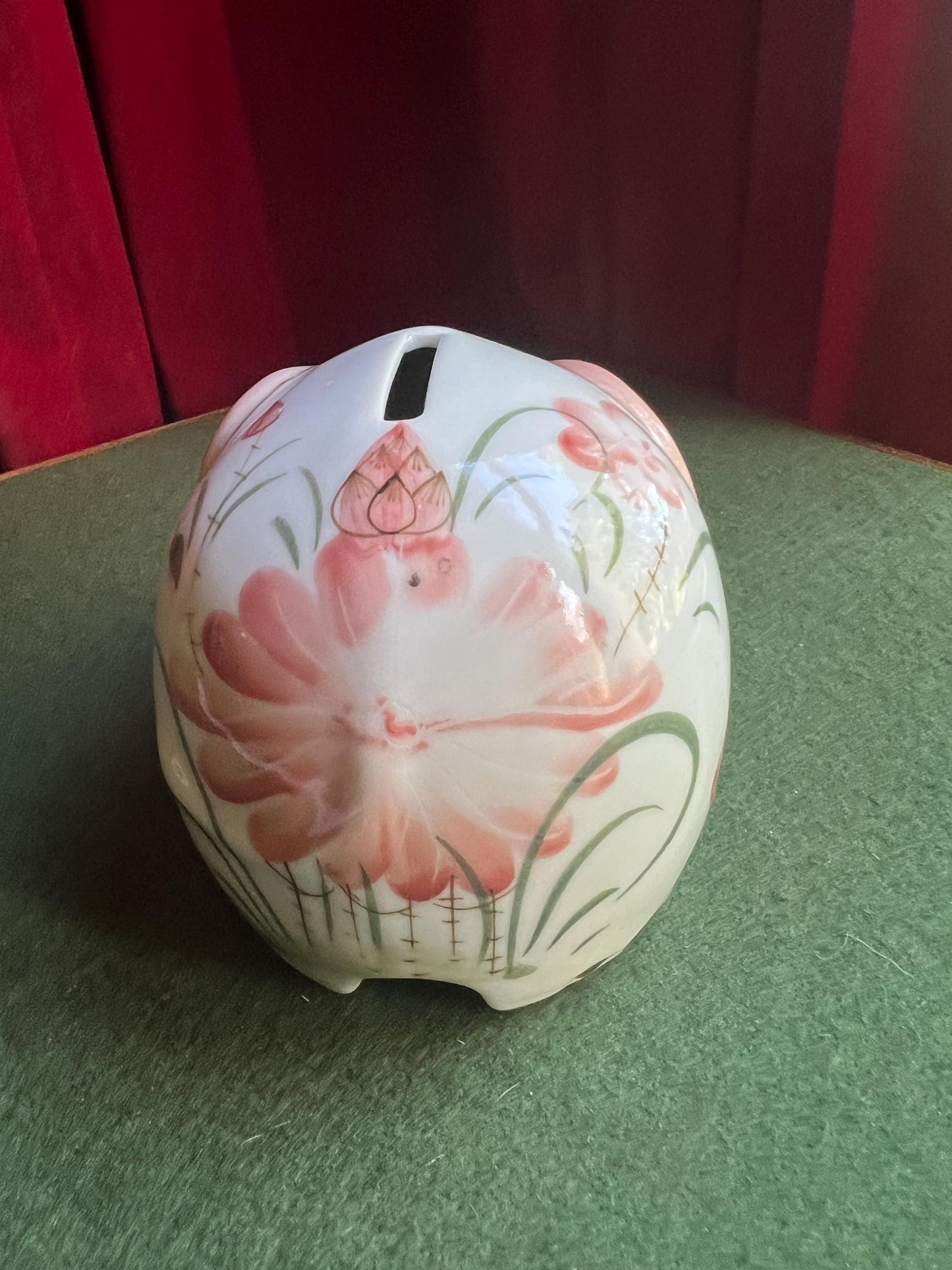 Ceramic elephant money box. Hand painted pink floral design. Made in Thailand.