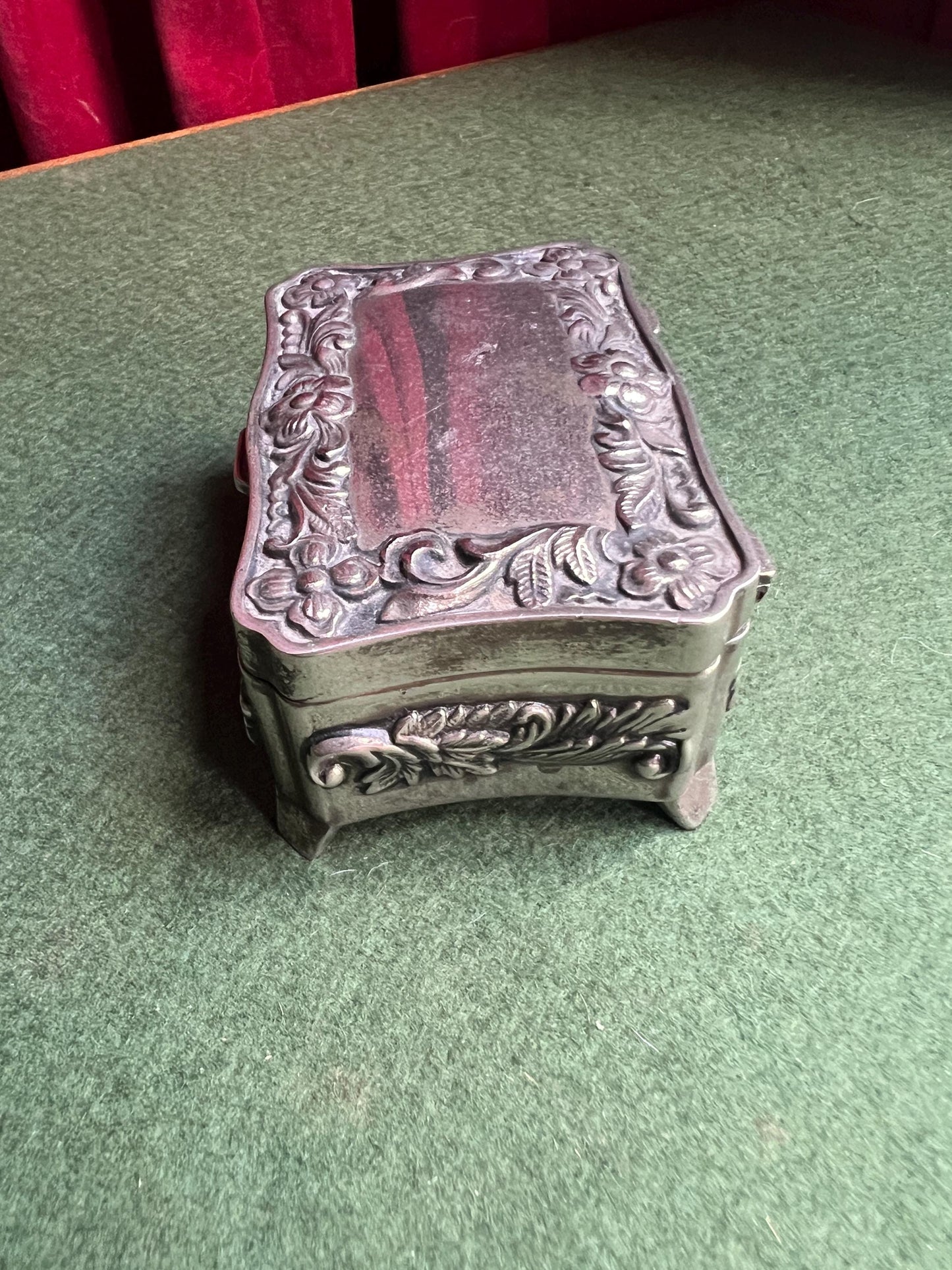 Vintage silver tone jewellery box. Embossed floral design treasure box blue lining.