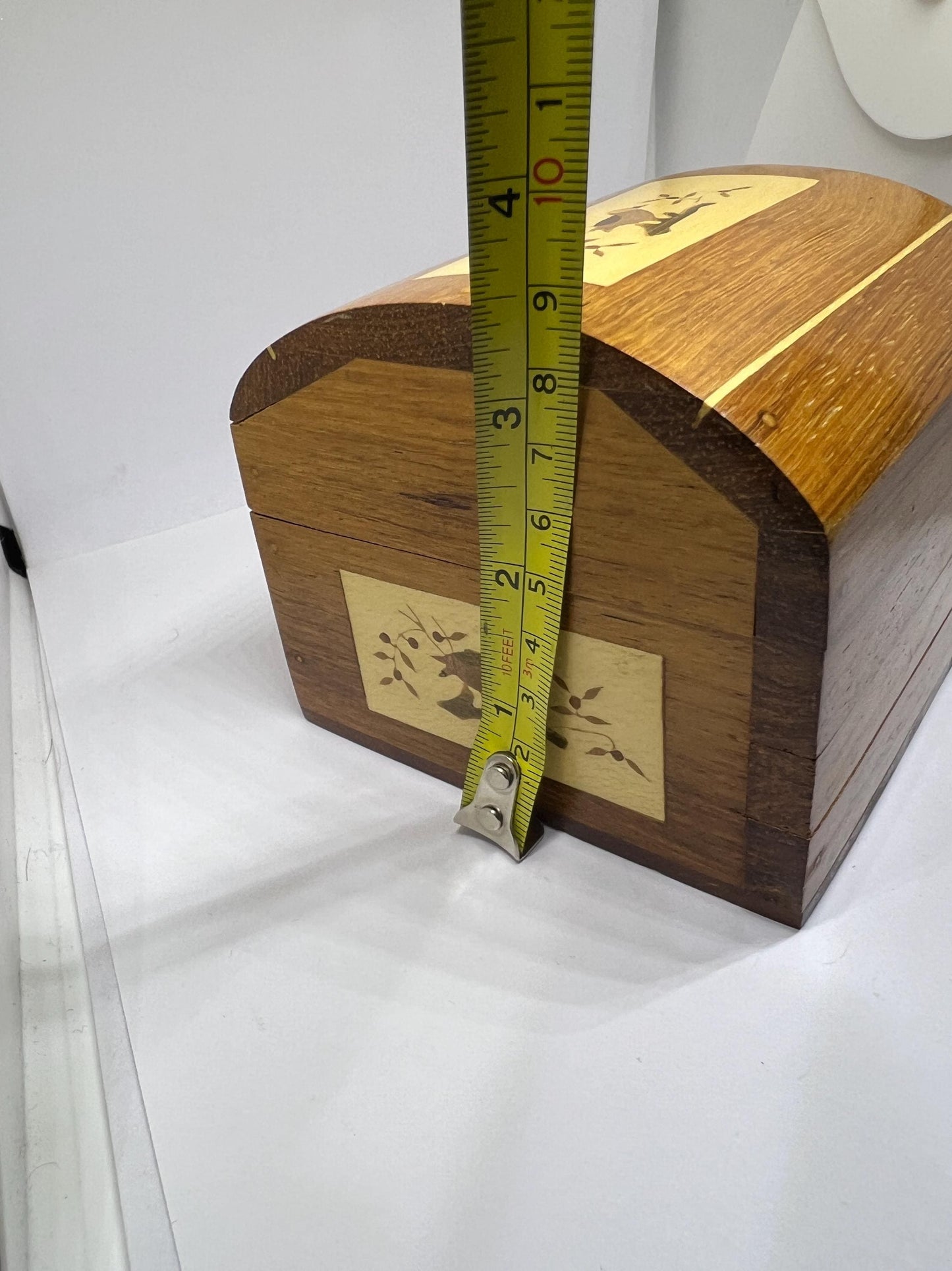 Wooden lidded secret lock treasure box. Inlaid marquetry bird themed domed jewellery box.