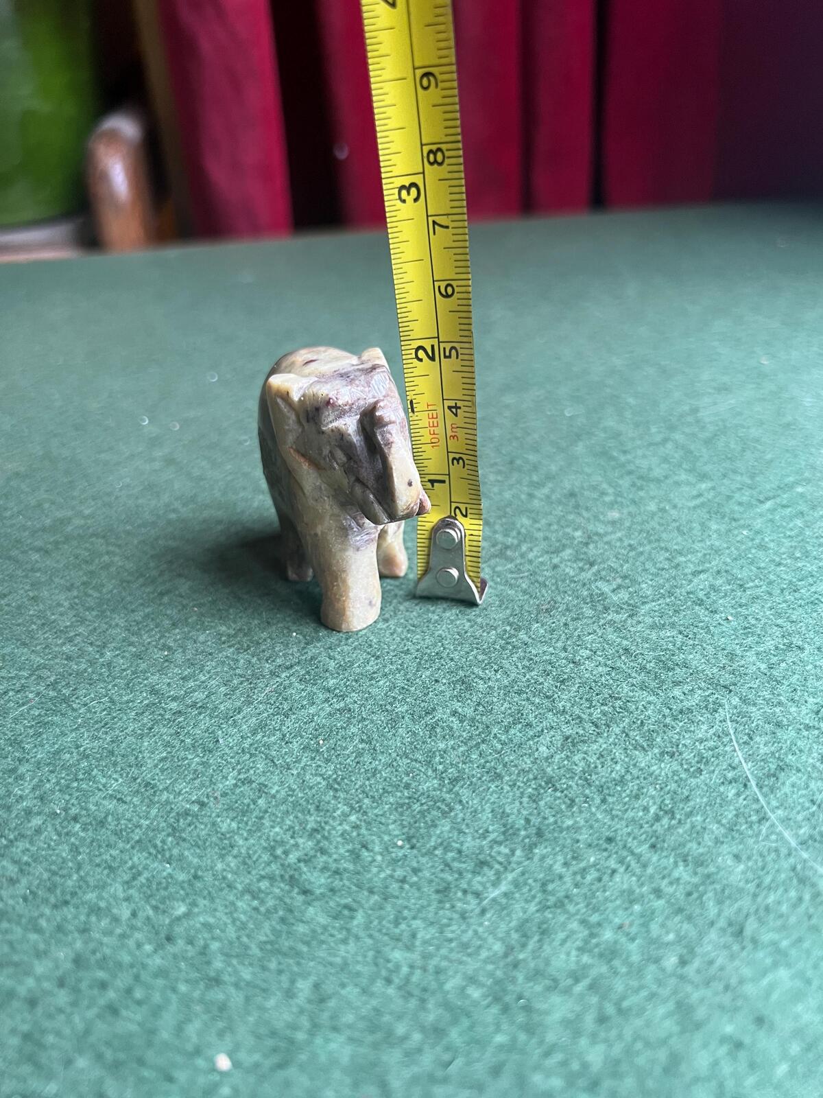 Stone elephant figure. Miniature marble hand carved lucky elephant.