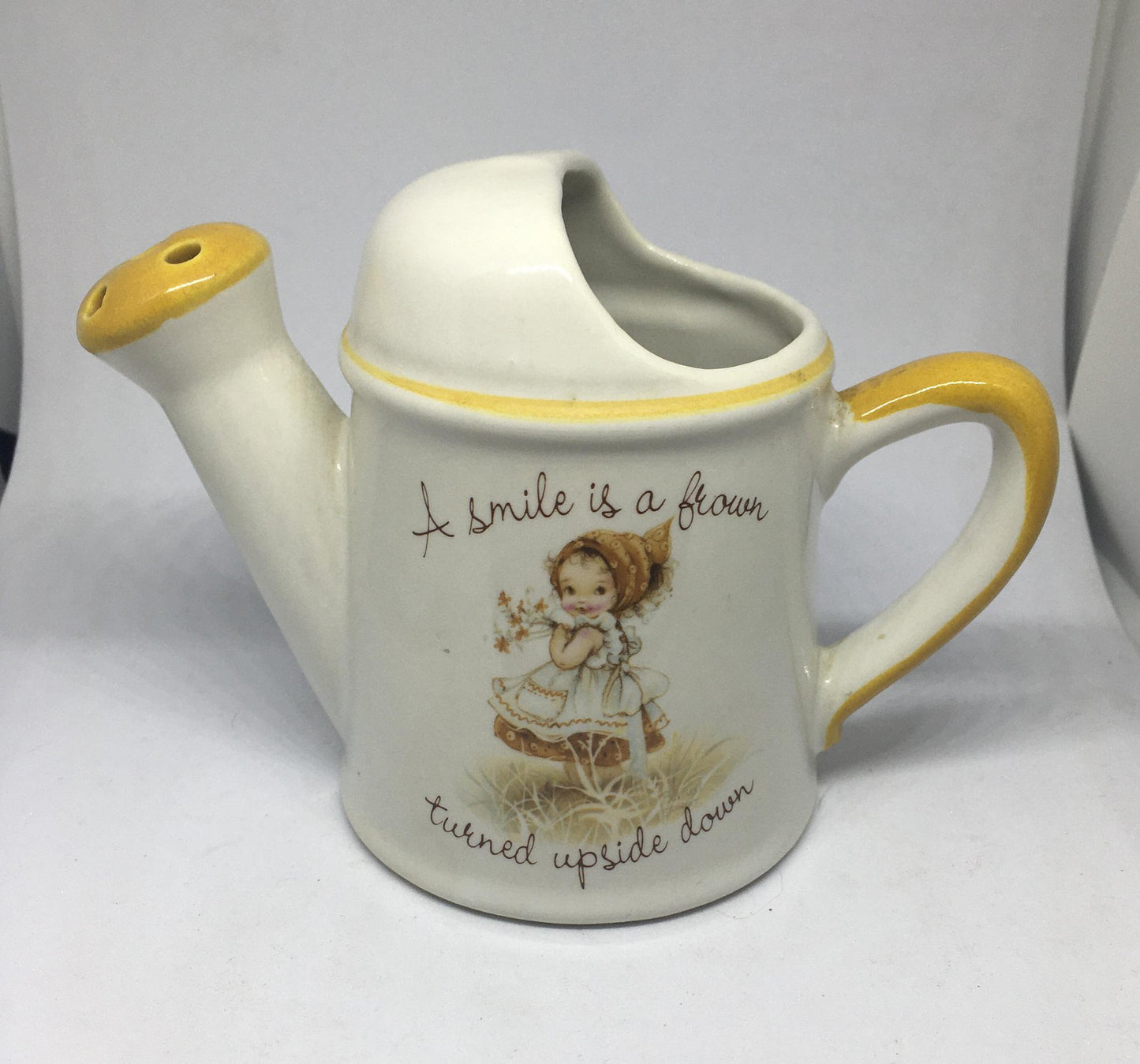 Ceramic watering can Vintage Gretchen Stoneware ceramic watering can ornament. 1970s kitsch. A smile is a frown turned upside down.