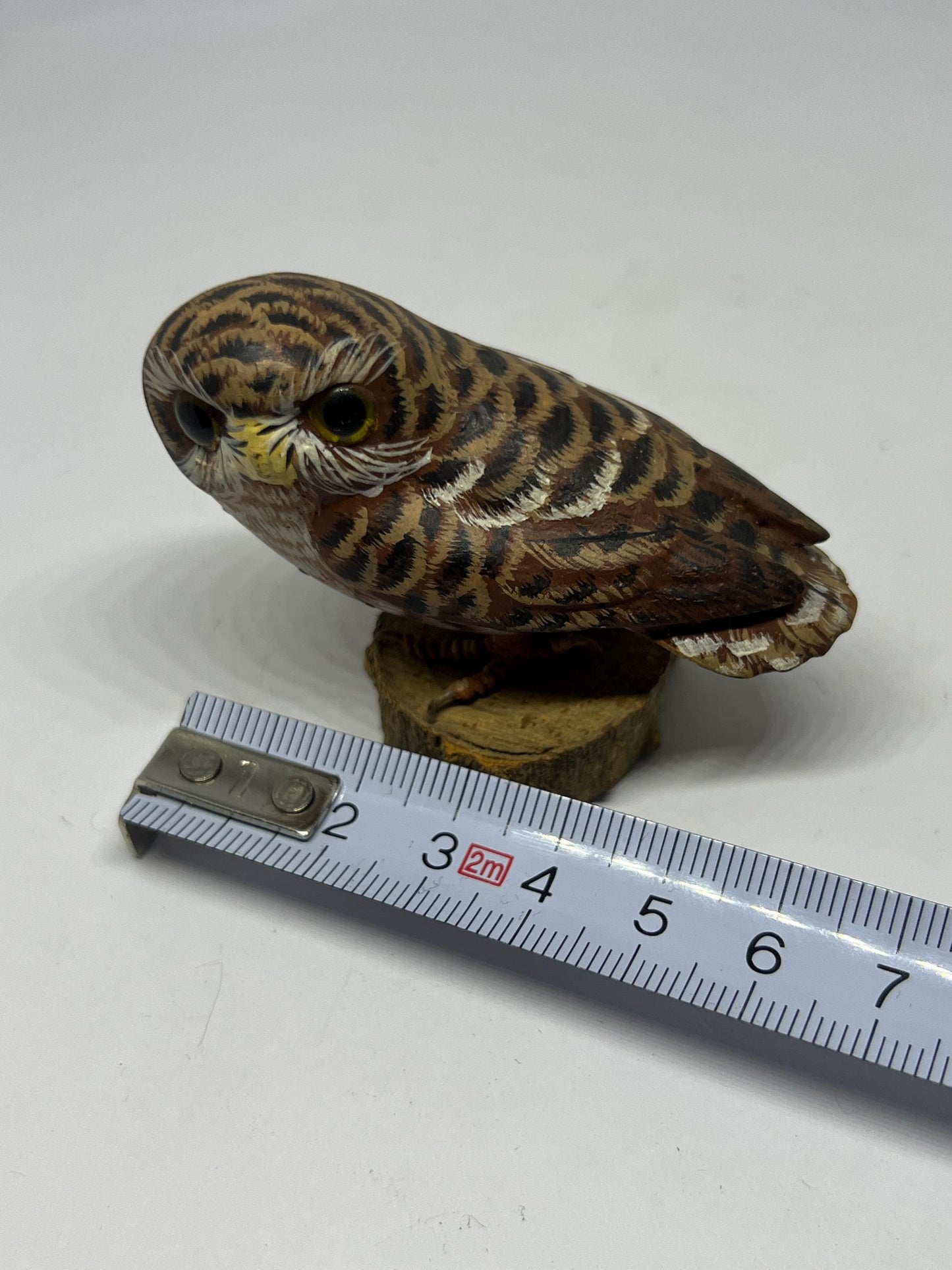 Vintage Hand Carved Wood Saw Whet Owl Hand painted with glass eyes on tree stump base.