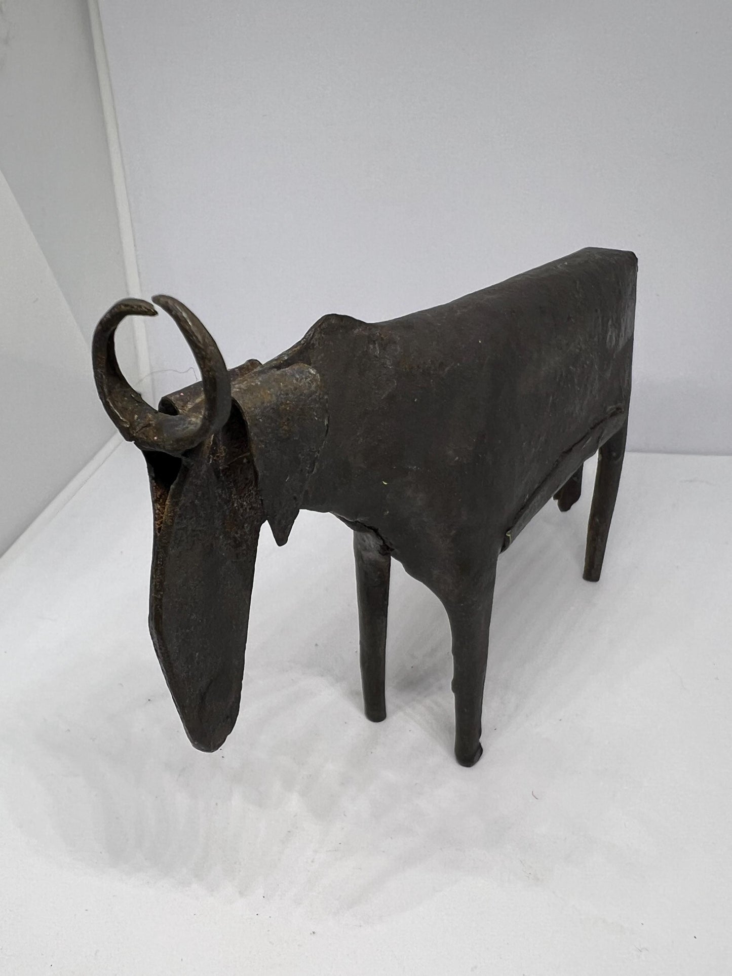 Brutalist metal cow sculpture.  Iron abstract folk art figurine.