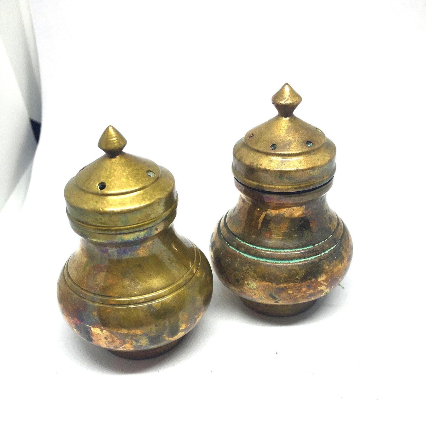 Unusual brass salt and pepper shakers. Screw off lids plastic inserts.