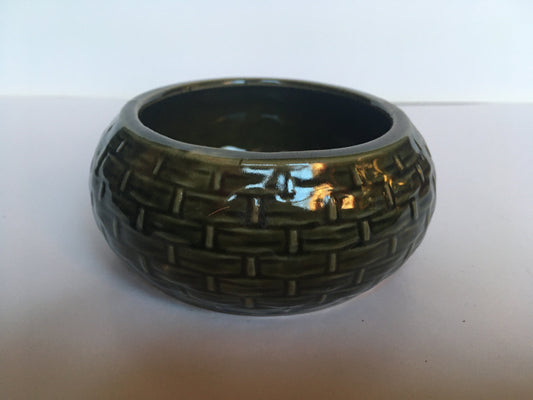 Beautiful vintage dark green glaze trinket dish with basket weave pattern.