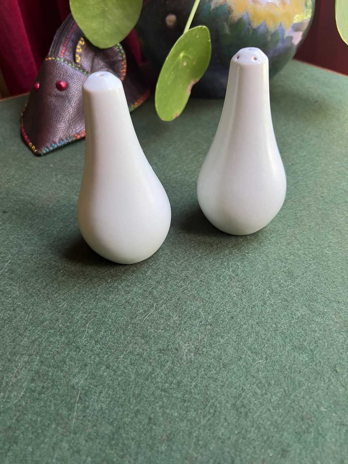 Ceramic salt and pepper shakers. Hand painted red and yellow flowers. Radford.