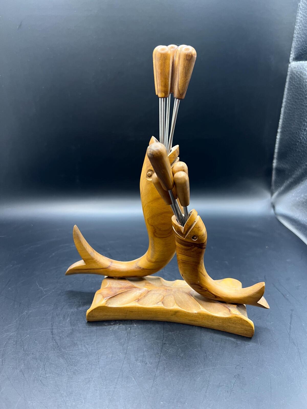 Wooden olive serving set. MCM carved olive wood fish design with 6 forks and 4 picks.