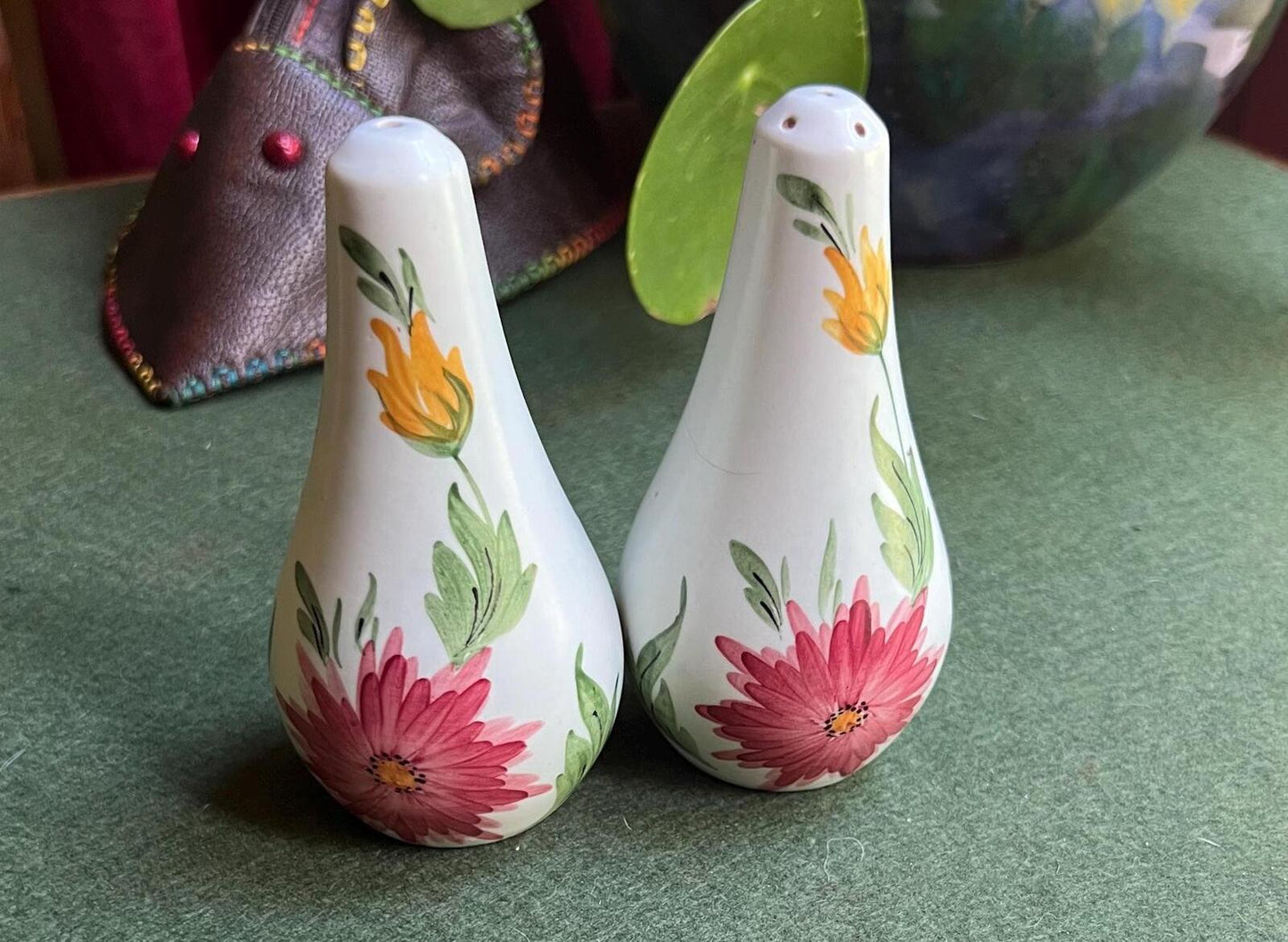 Ceramic salt and pepper shakers. Hand painted red and yellow flowers. Radford.