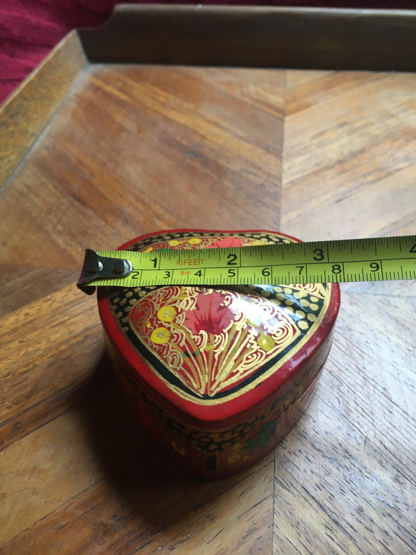 Beautiful hand-painted heart shaped lidded box.
