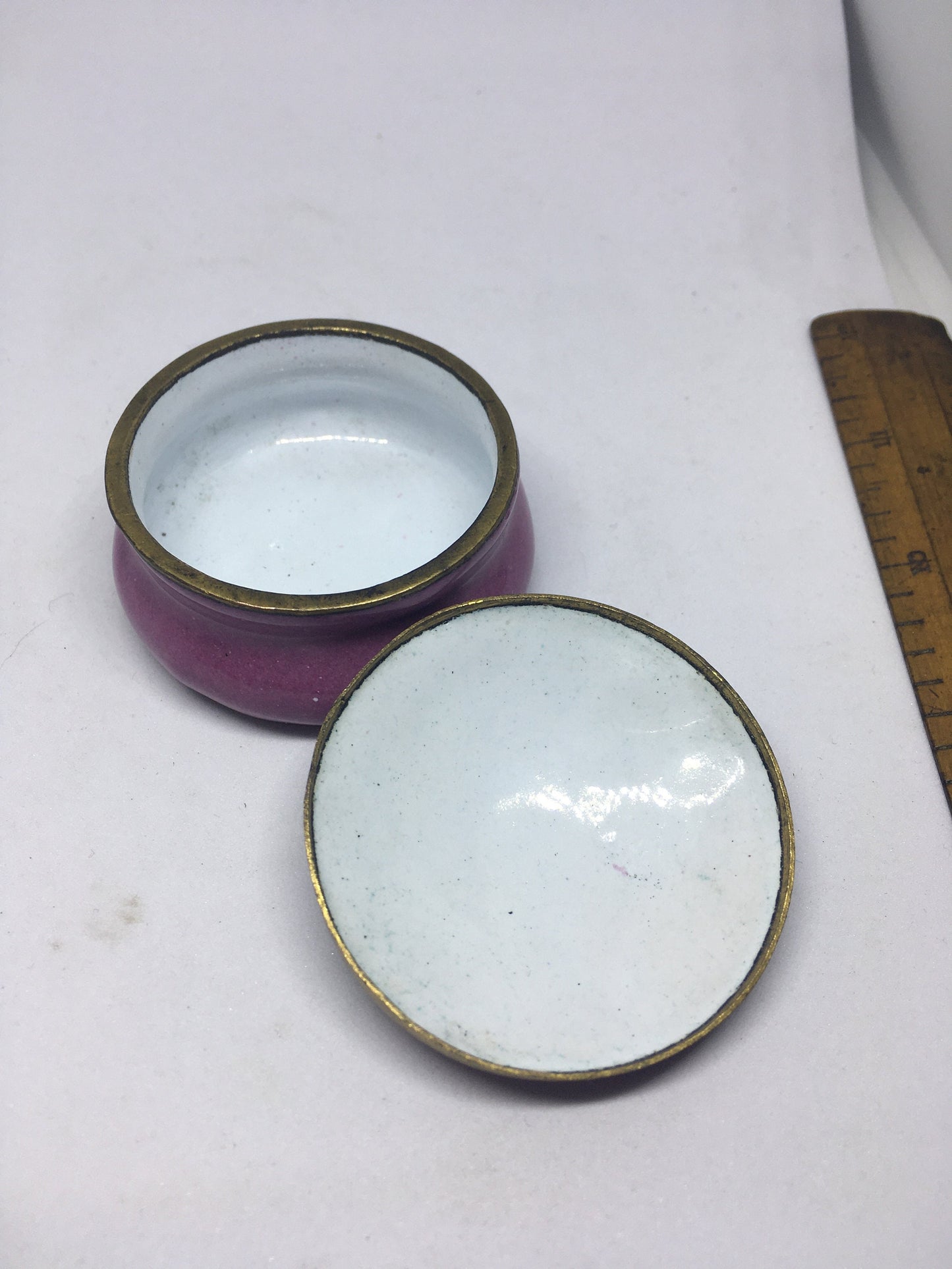 Enamel cloisonne lidded trinket box. Purple enamel with butterfly and flower decoration.