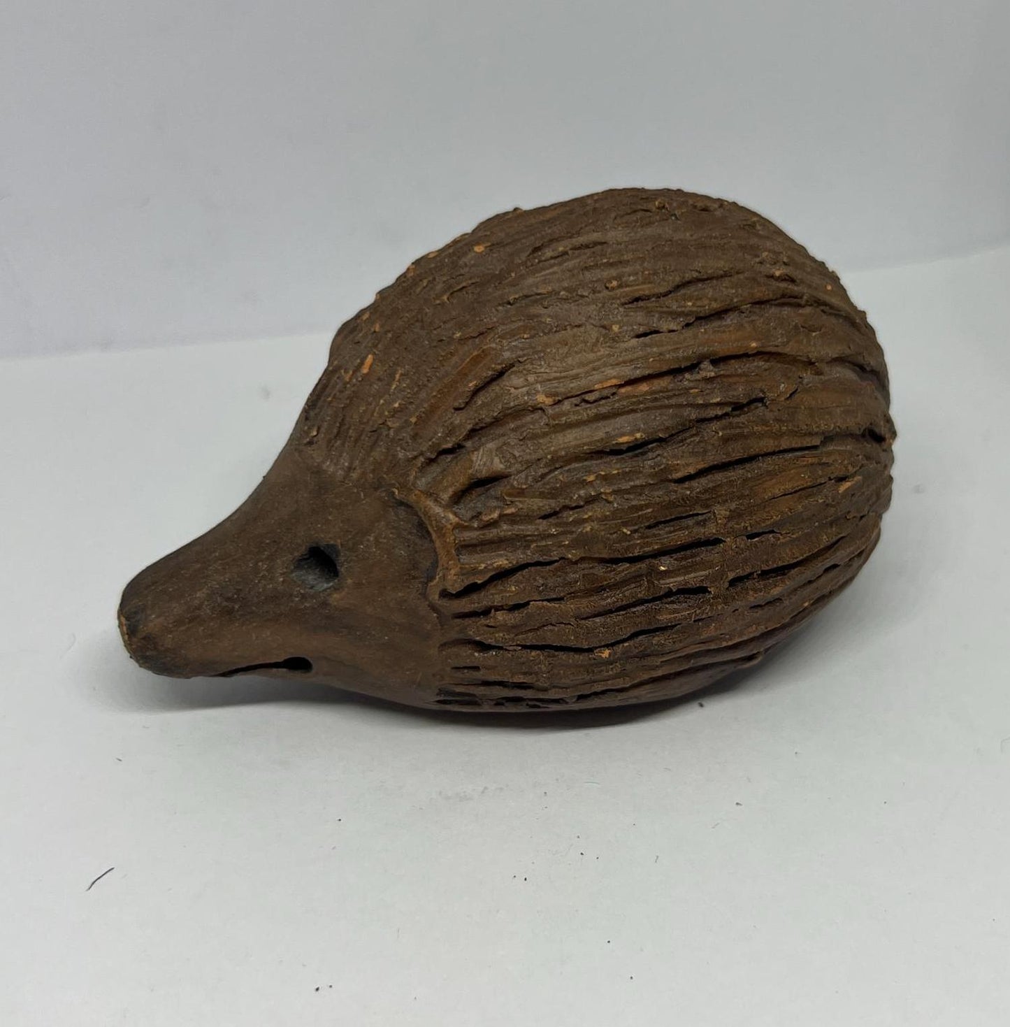 Terracotta hedgehog ornament.