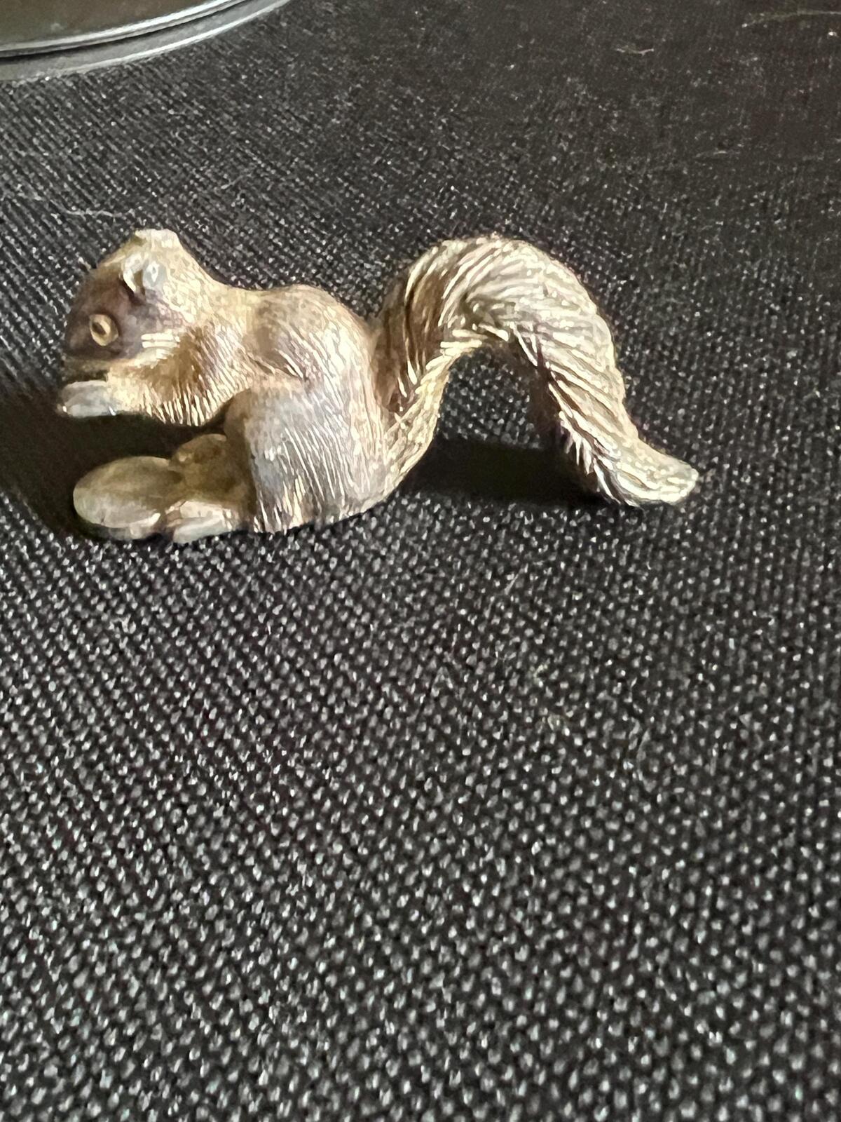Vintage silver tone squirrel figurine. Miniature metal squirrel ornament.
