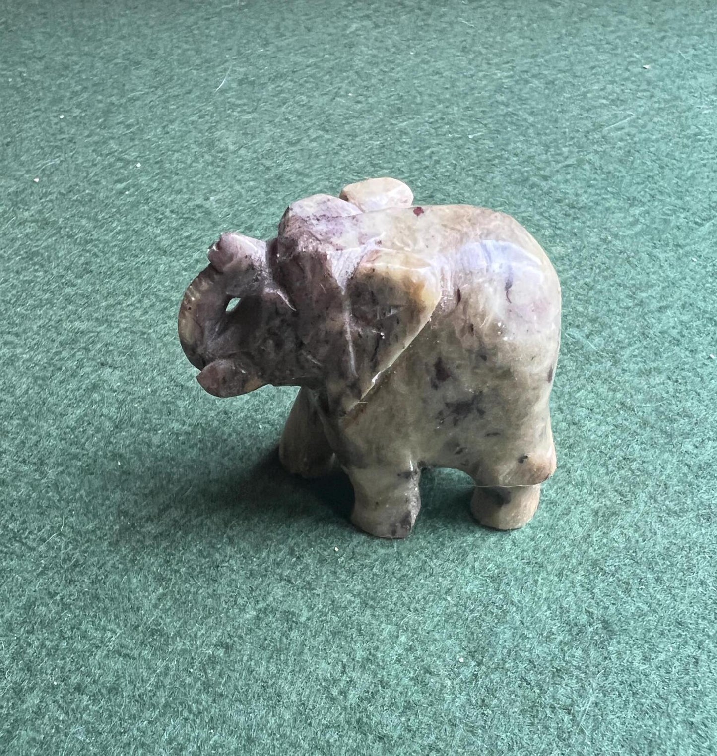 Stone elephant figure. Miniature marble hand carved lucky elephant.