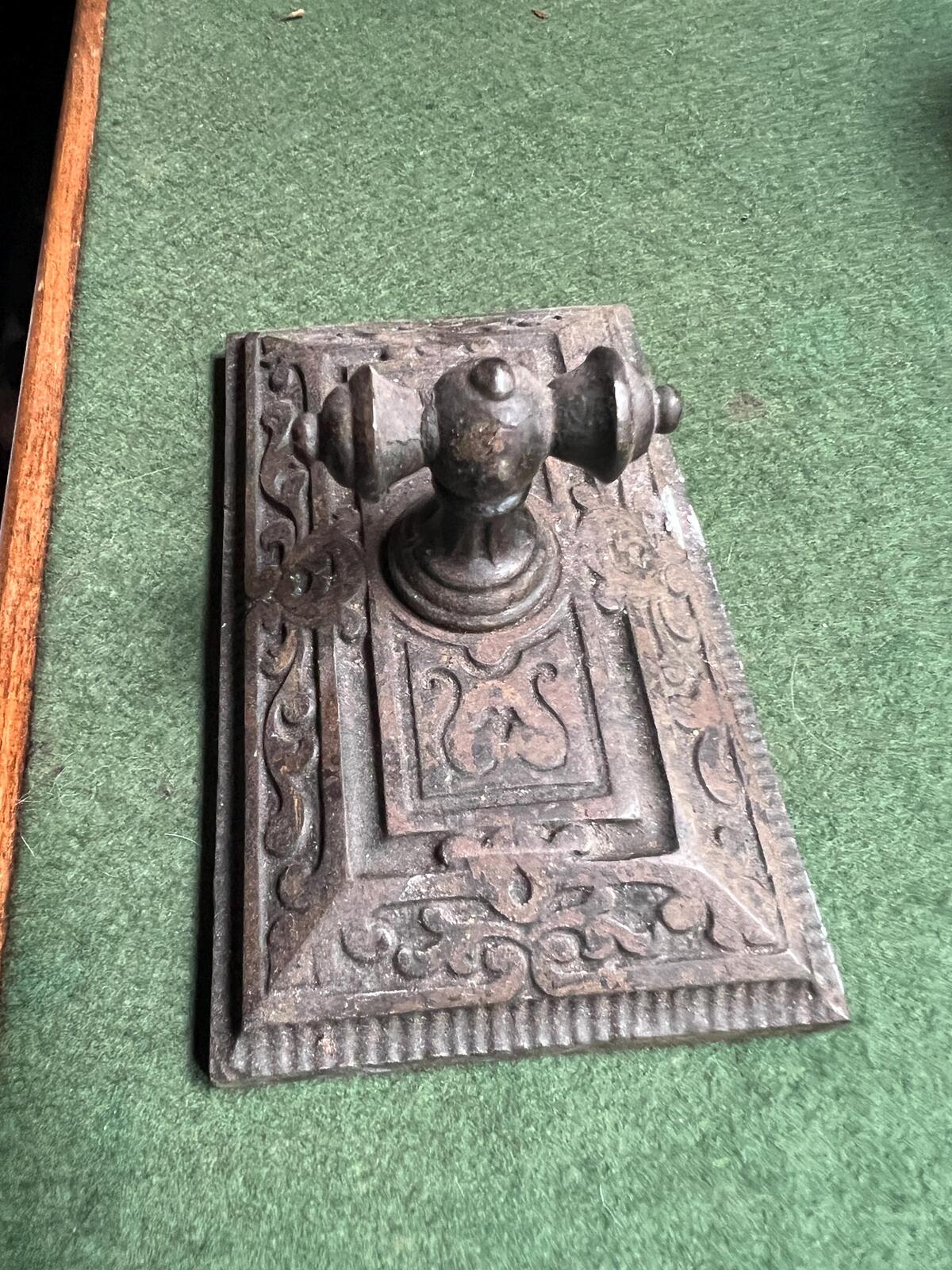 Ornate antique cast iron paperweight. Handled Victorian paperweight doorstop. Decorative pyramid swirl patterned quirky paperweight.