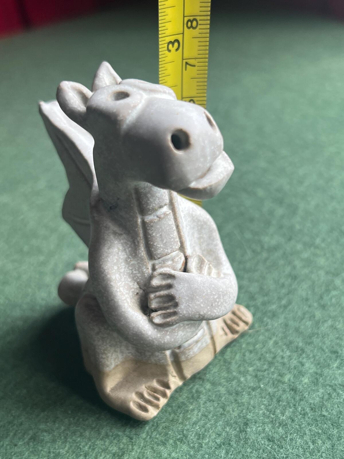 Hand built pottery dragon figurine. Grey clay ready to be painted dragon.